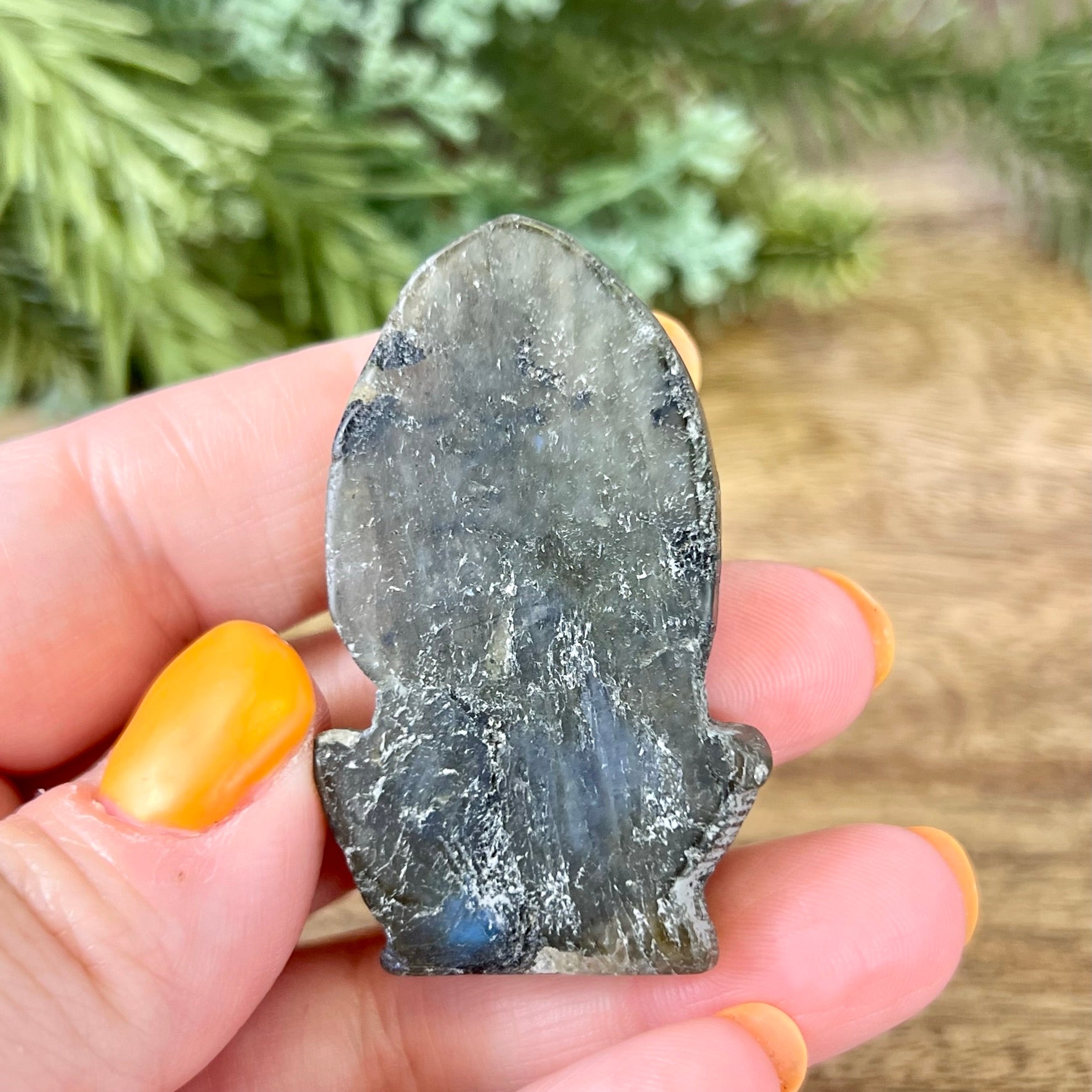 a person holding a piece of rock in their hand