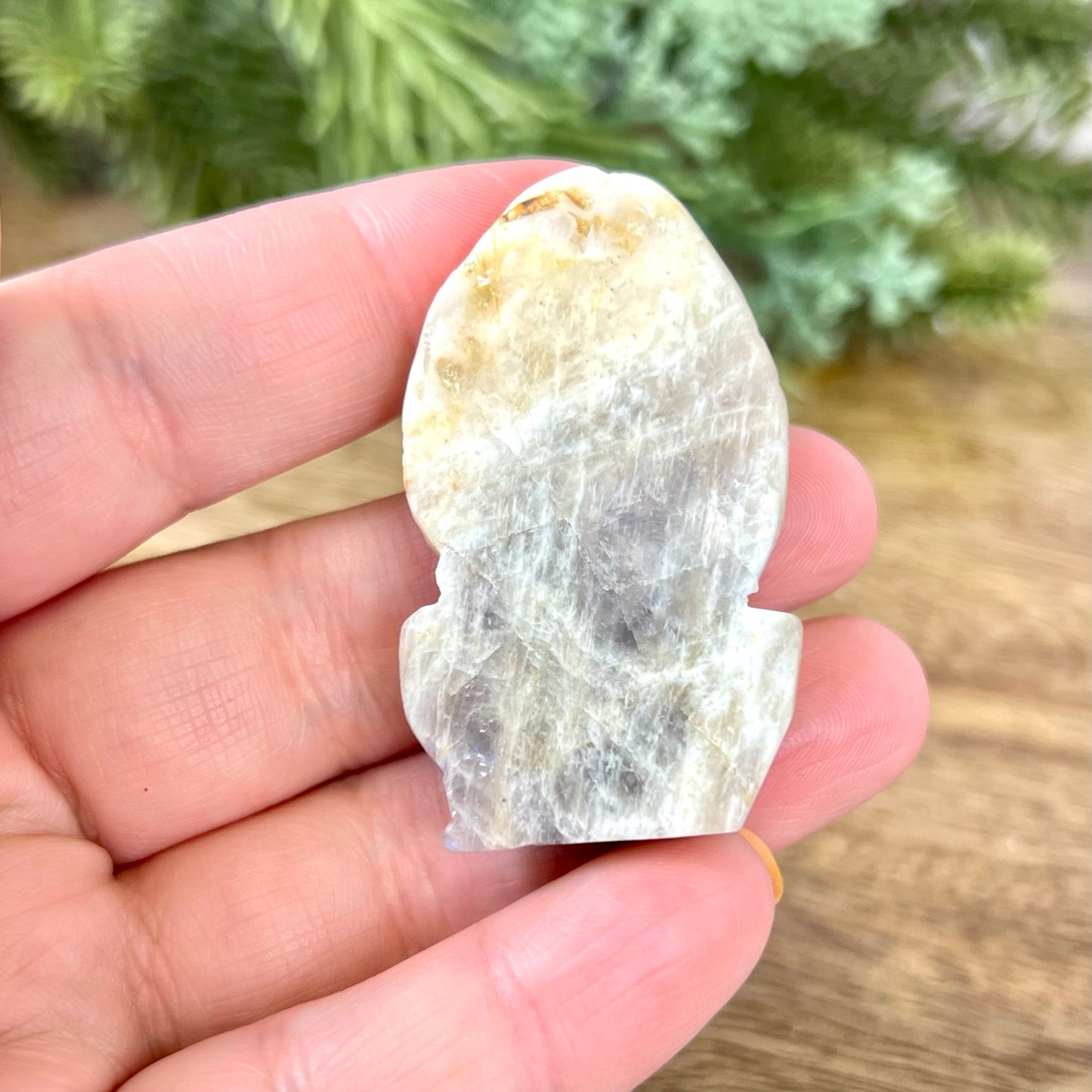 a person holding a piece of rock in their hand