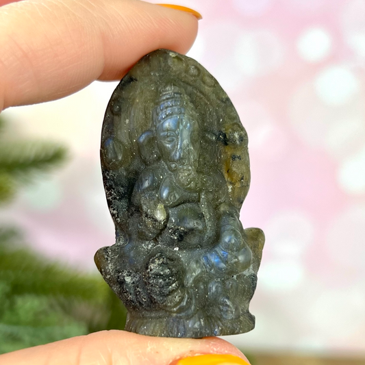 a person holding a piece of stone in their hand
