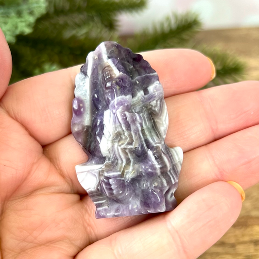 a person holding a rock in their hand
