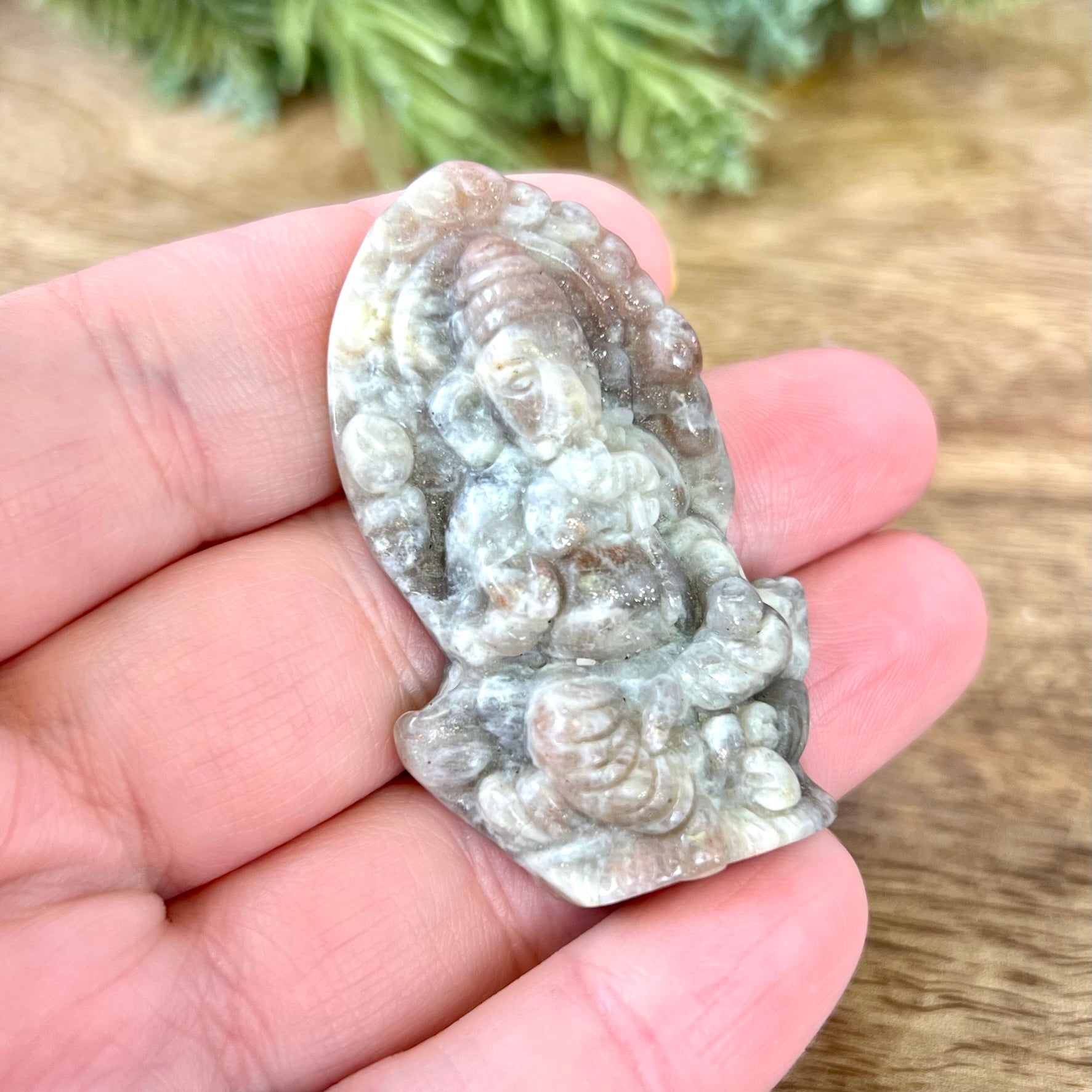 a person holding a small piece of stone in their hand