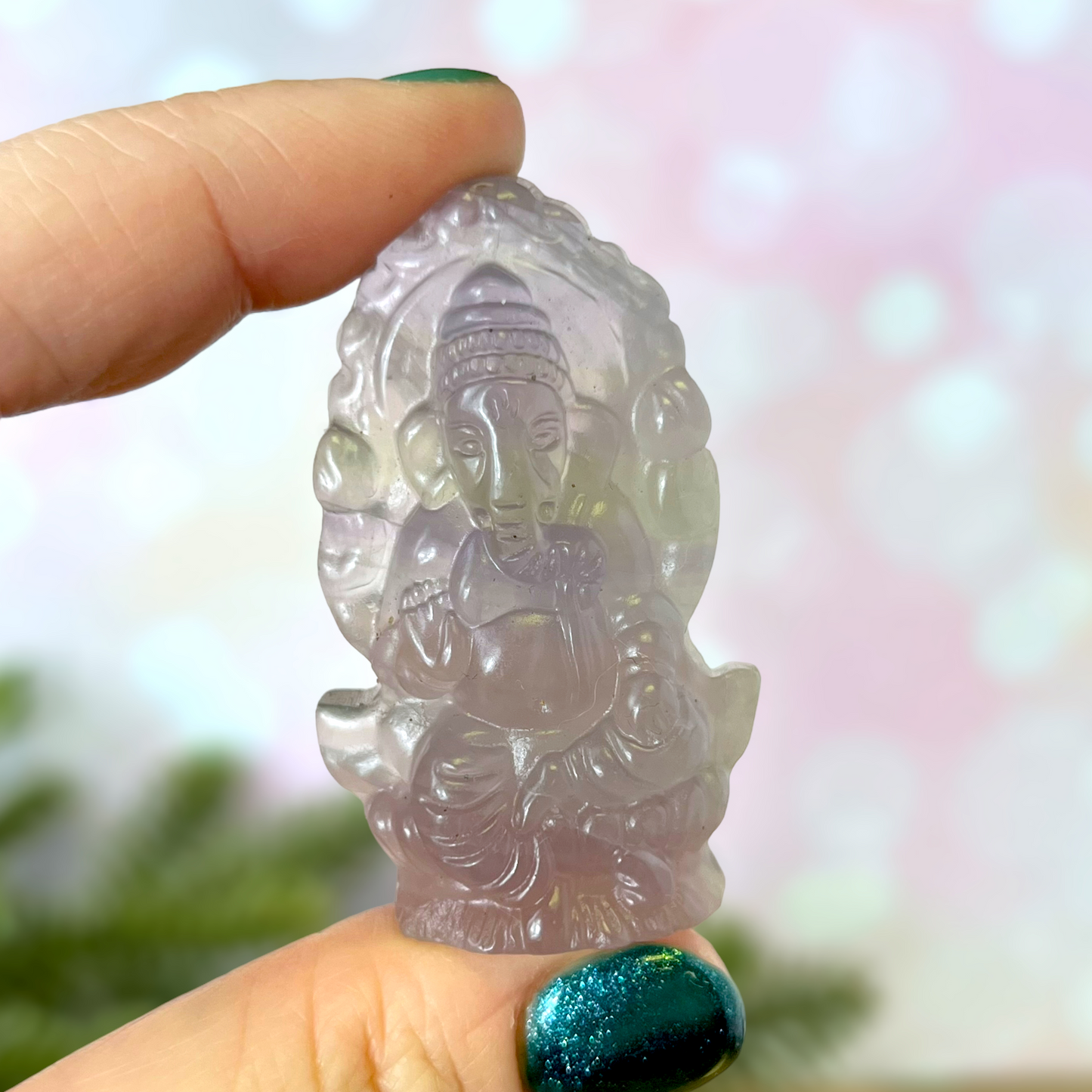 a person holding a small plastic object in their hand