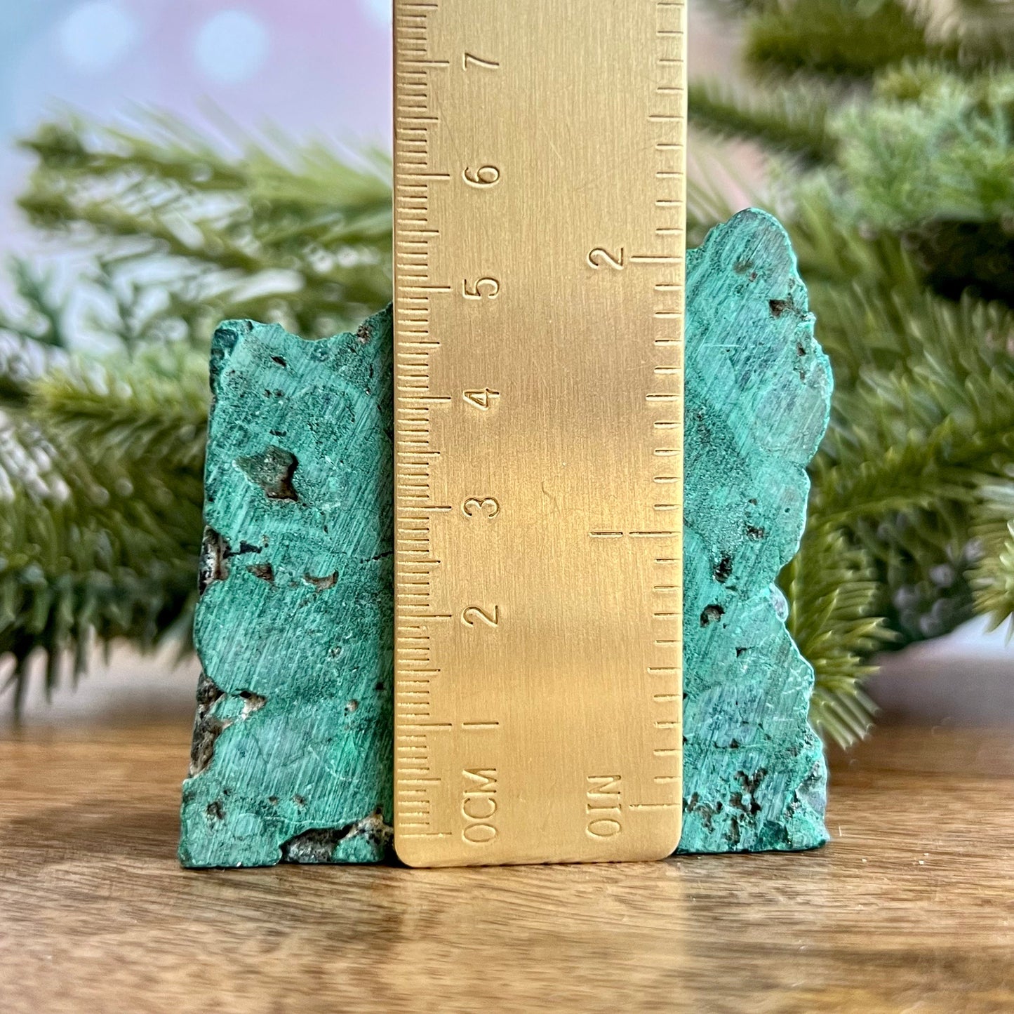 Cut slab of Malachite. Unpolished with a frosted finish. The back is natural and raw.
