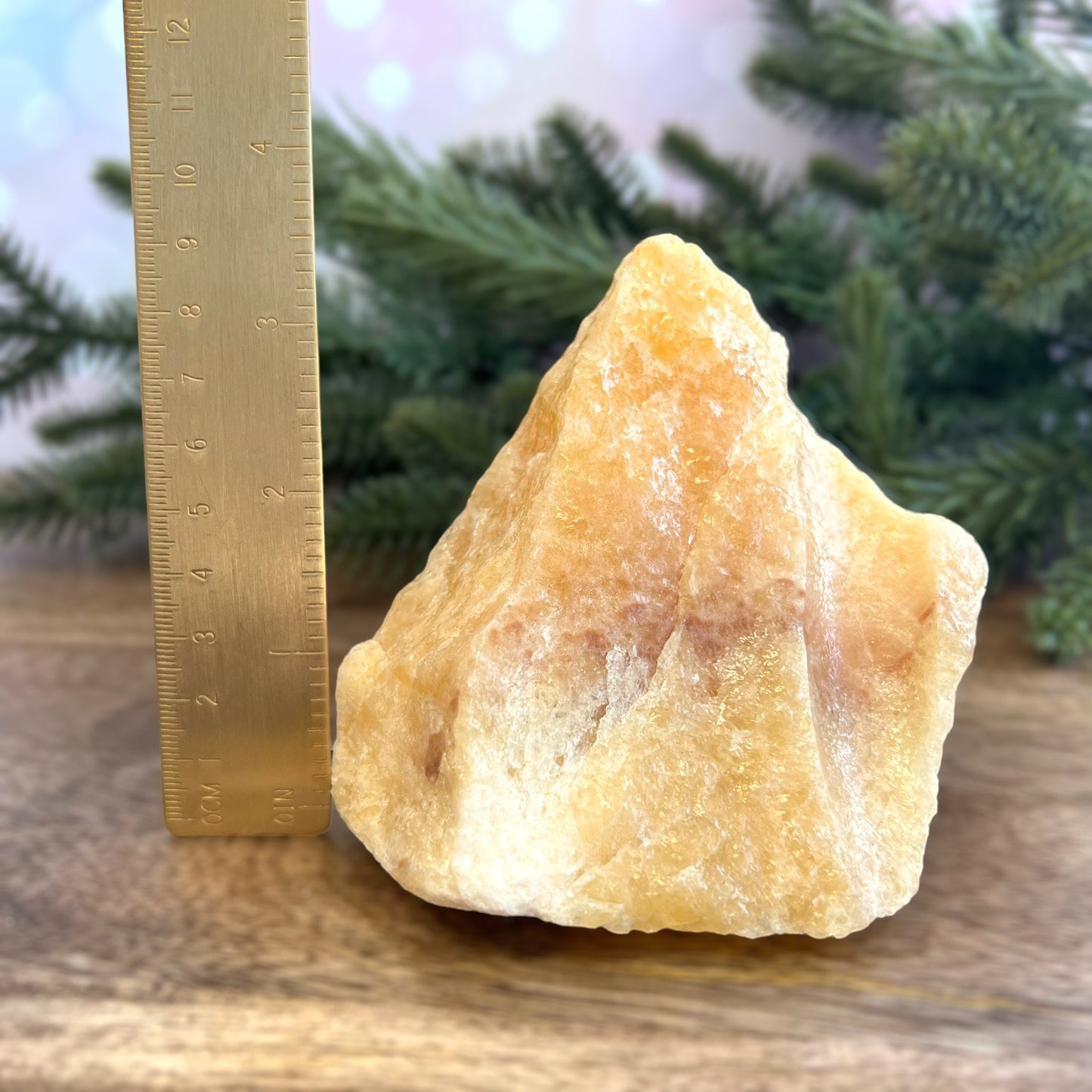 Image of a large, rough chunk piece of yellow Calcite crystal from Mexico. Very sunny color with a darker band. Rough on all edges, with a cylinder cut out on one side.