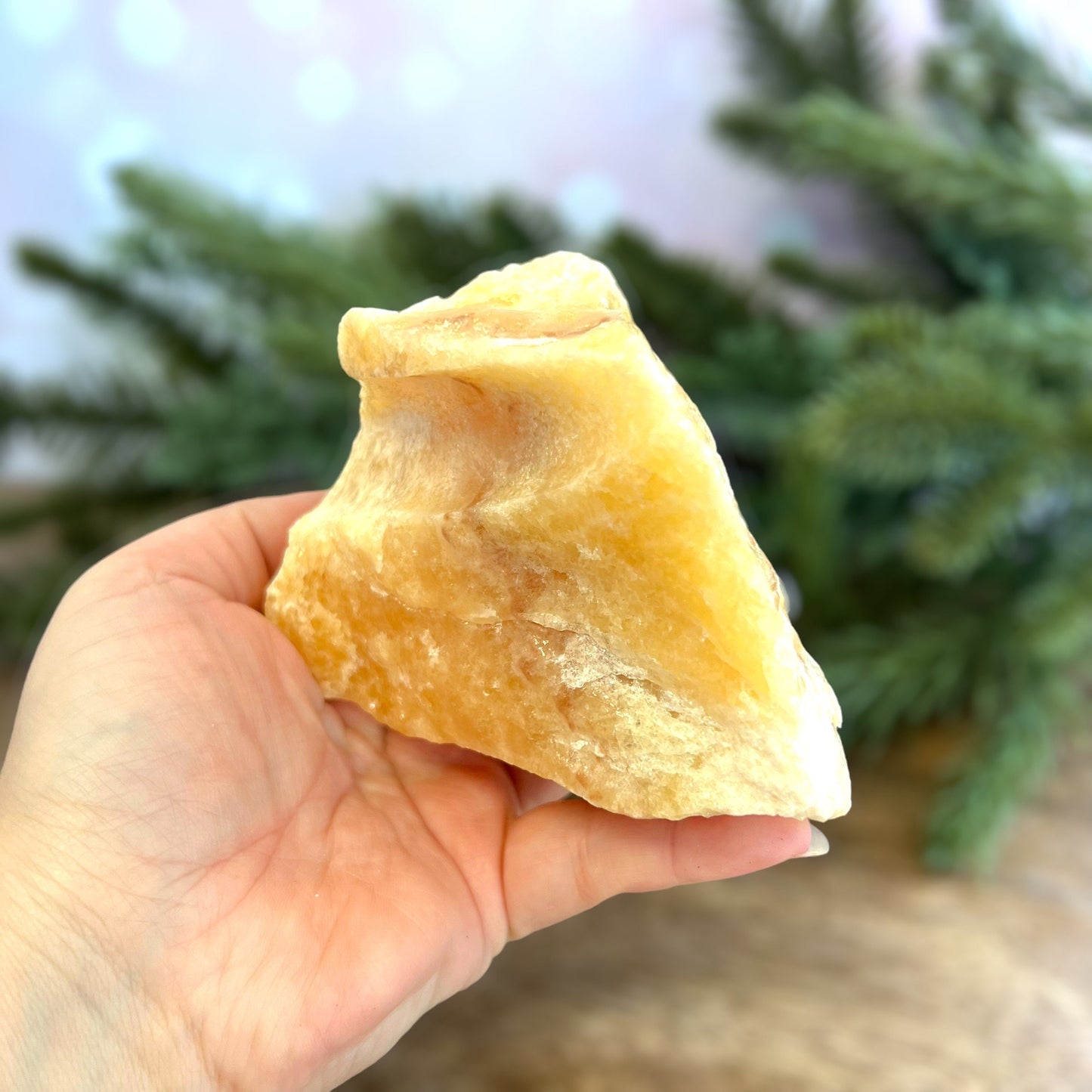 Image of a large, rough chunk piece of yellow Calcite crystal from Mexico. Very sunny color with a darker band. Rough on all edges, with a cylinder cut out on one side.