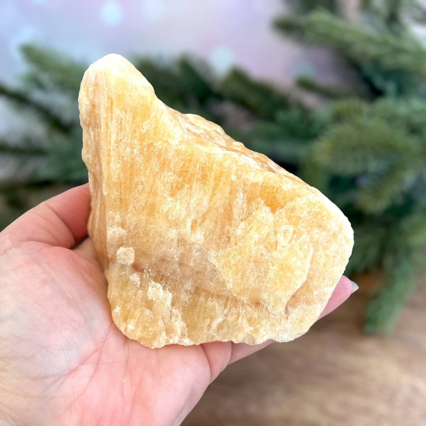 Image of a large, rough chunk piece of yellow Calcite crystal from Mexico. Very sunny color with a darker band. Rough on all edges, with a cylinder cut out on one side.