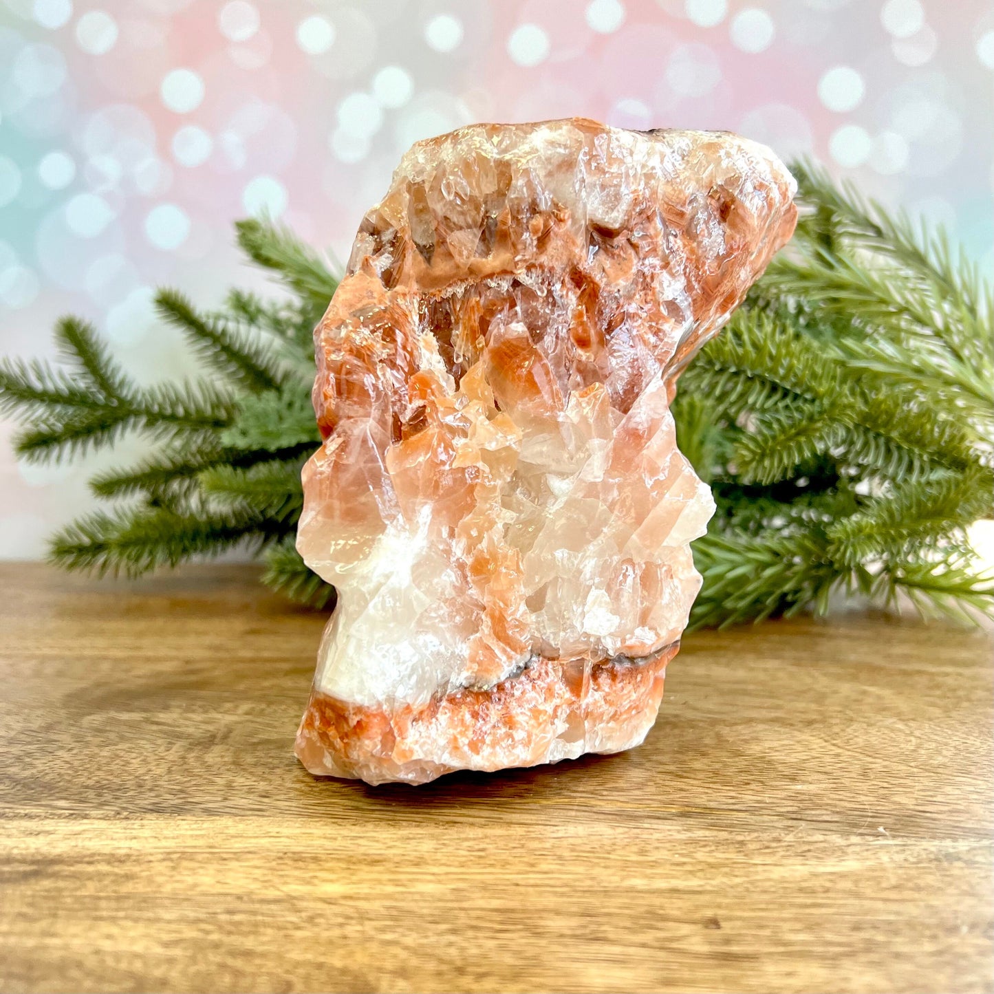 Image of a large, rough chunk piece of red Calcite crystal from Mexico. Has bands of light and dark color. Rough on all edges and rectangular in shape.