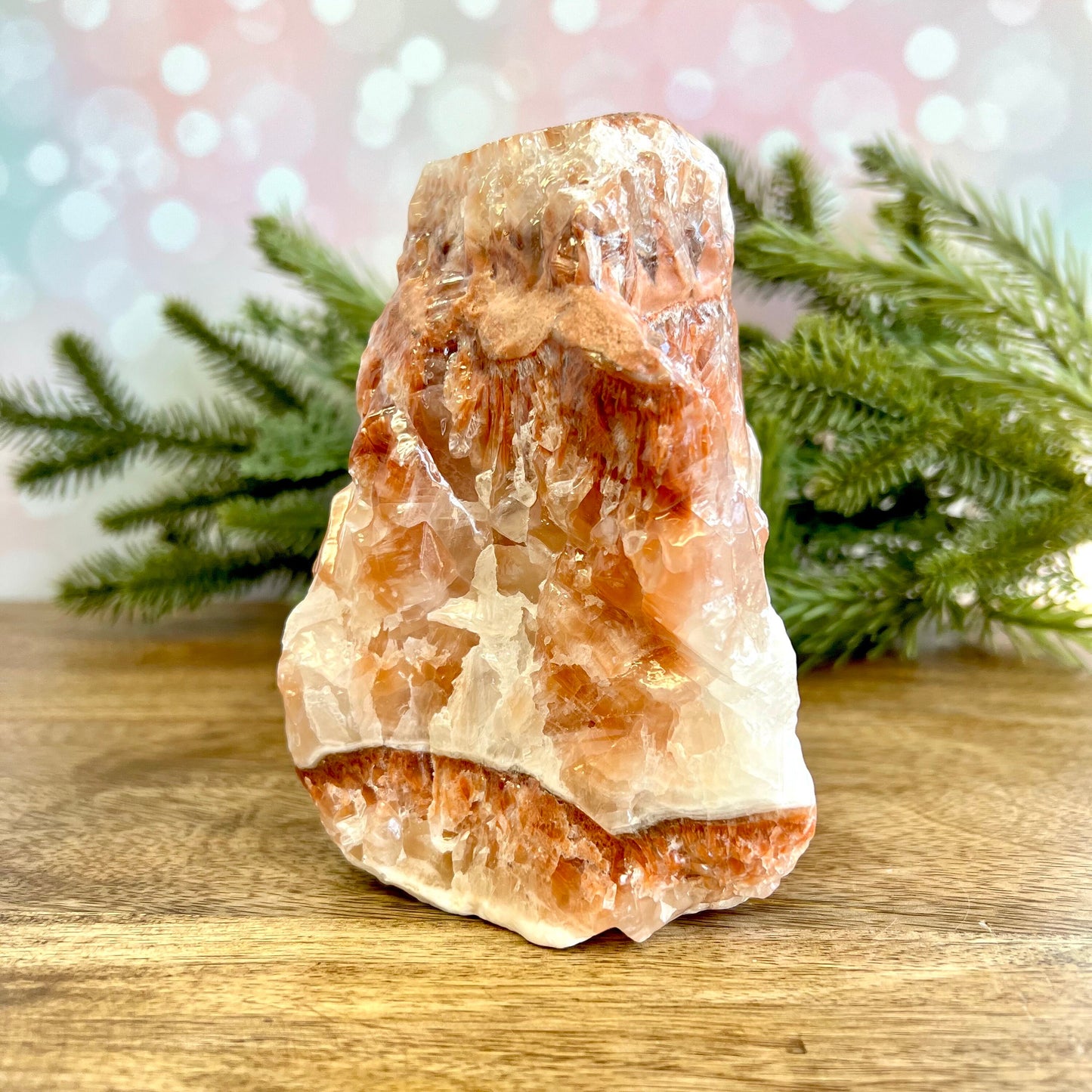 Image of a large, rough chunk piece of red Calcite crystal from Mexico. Has bands of light and dark color. Rough on all edges and rectangular in shape.