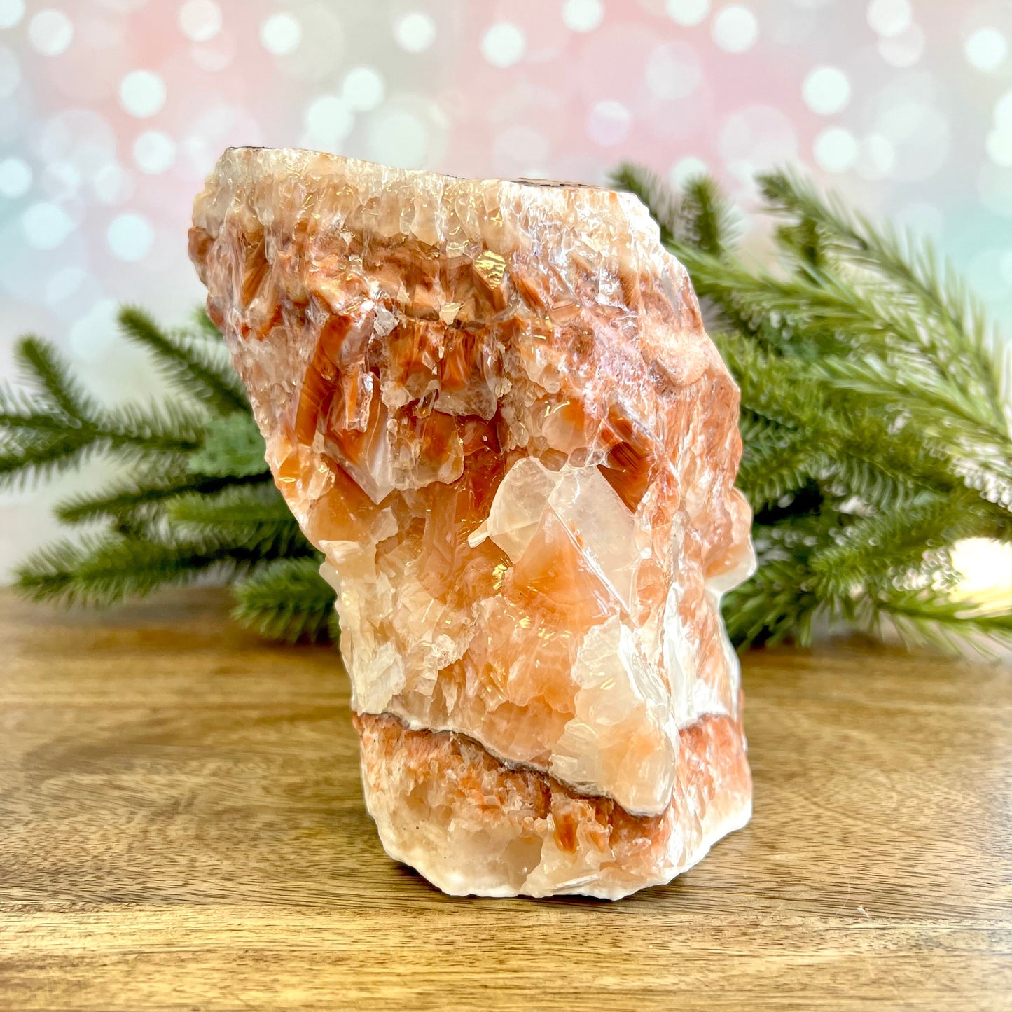 Image of a large, rough chunk piece of red Calcite crystal from Mexico. Has bands of light and dark color. Rough on all edges and rectangular in shape.
