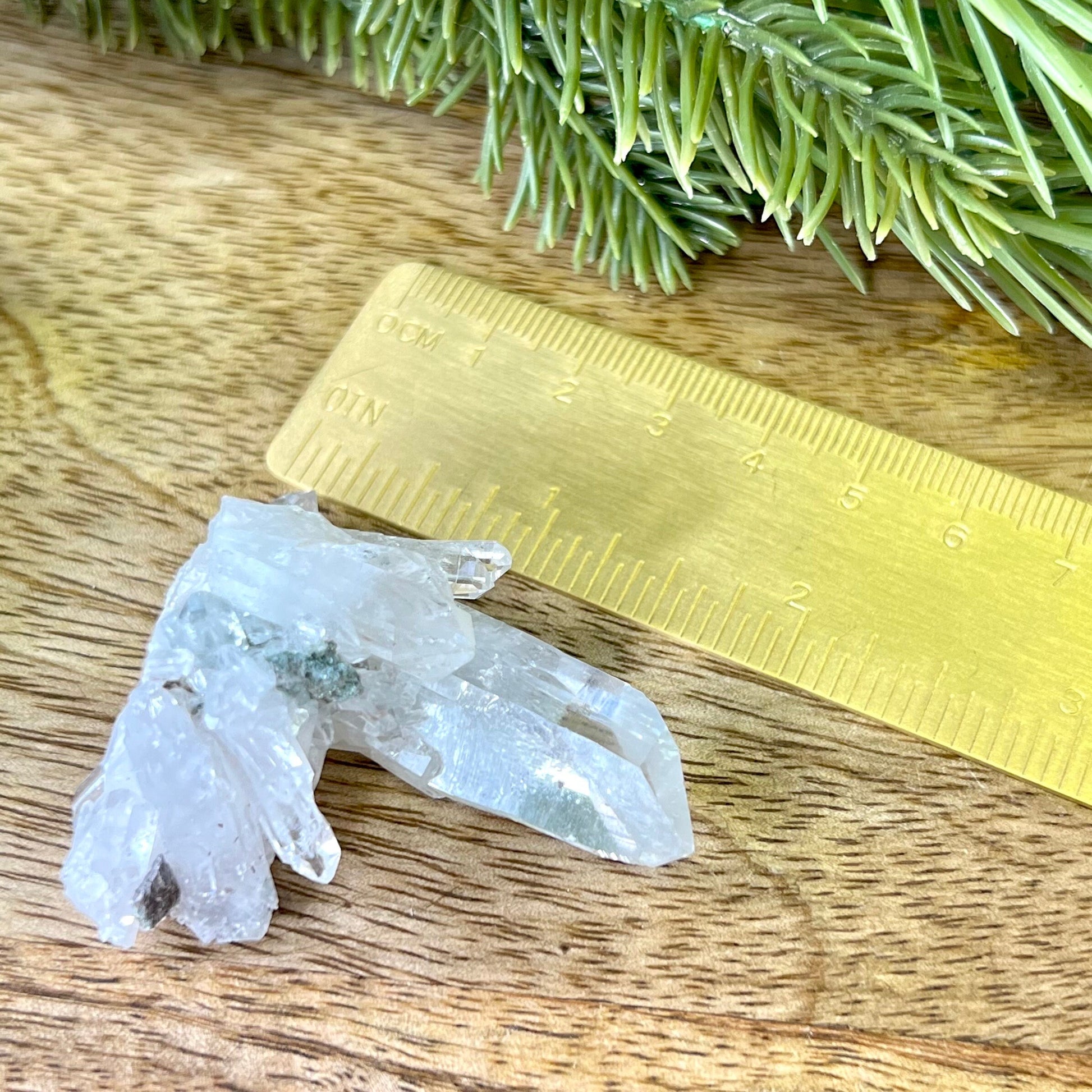 Close up of a Colombian clear Quartz crystal. It is very clear and has Lemurian horizontal lines.