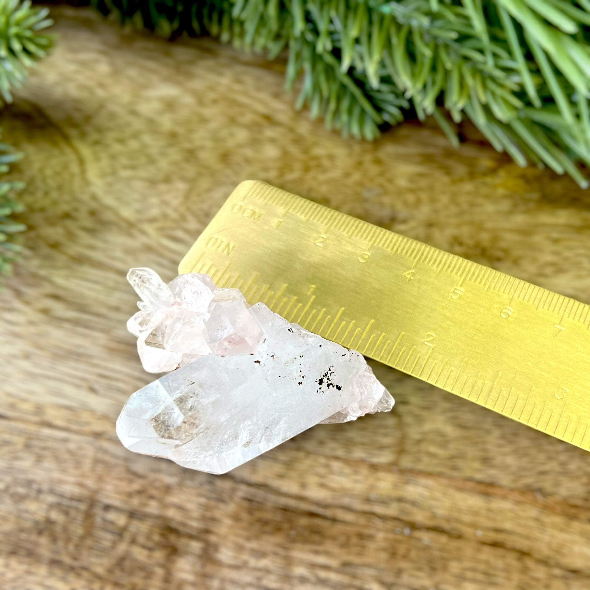 Close up of a Colombian clear Quartz crystal. It is very clear and has Lemurian horizontal lines.