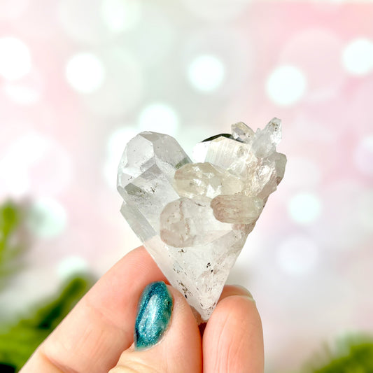 Close up of a Colombian clear Quartz crystal. It is very clear and has Lemurian horizontal lines.