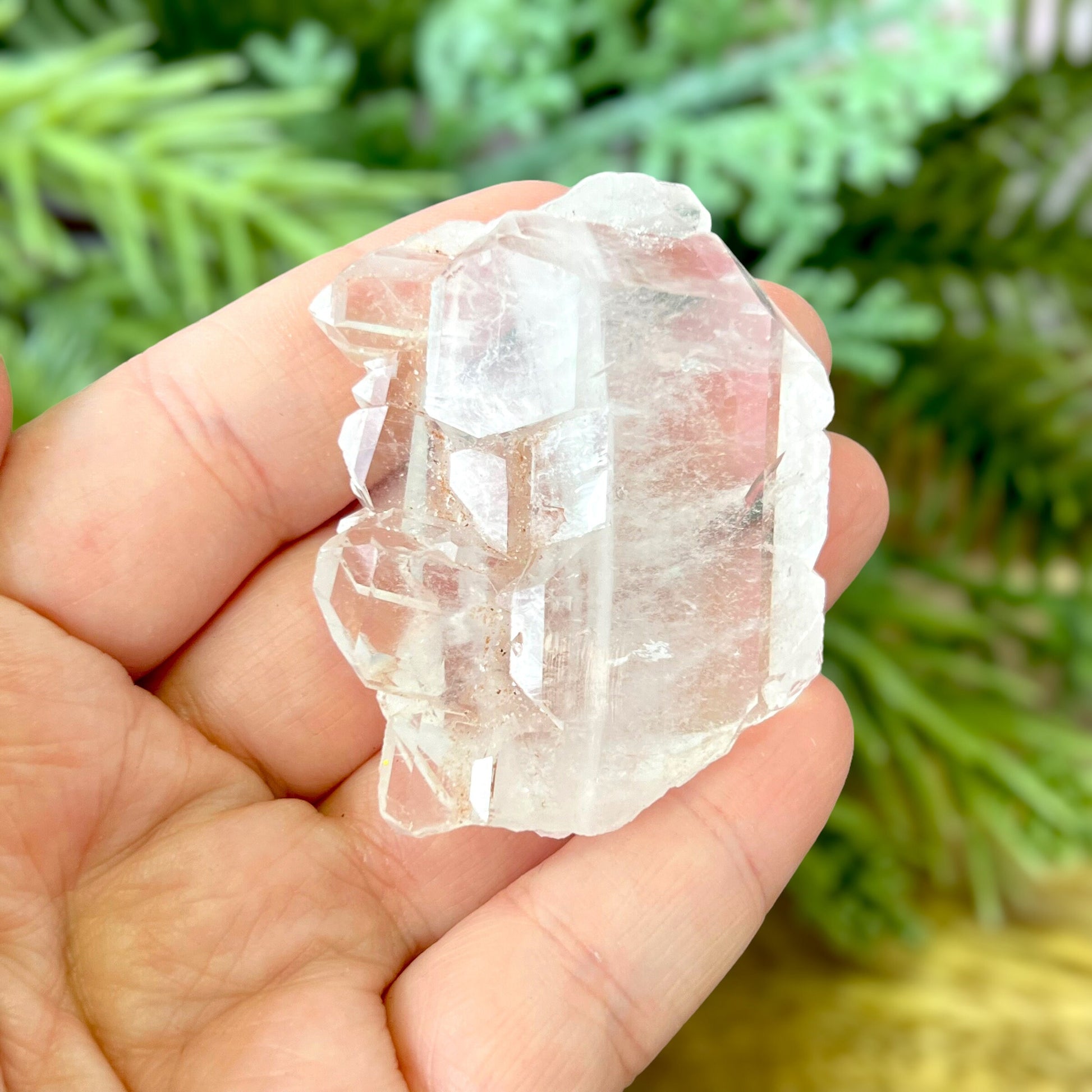 Close up of a Colombian clear Quartz crystal. It is very clear and has Lemurian horizontal lines.