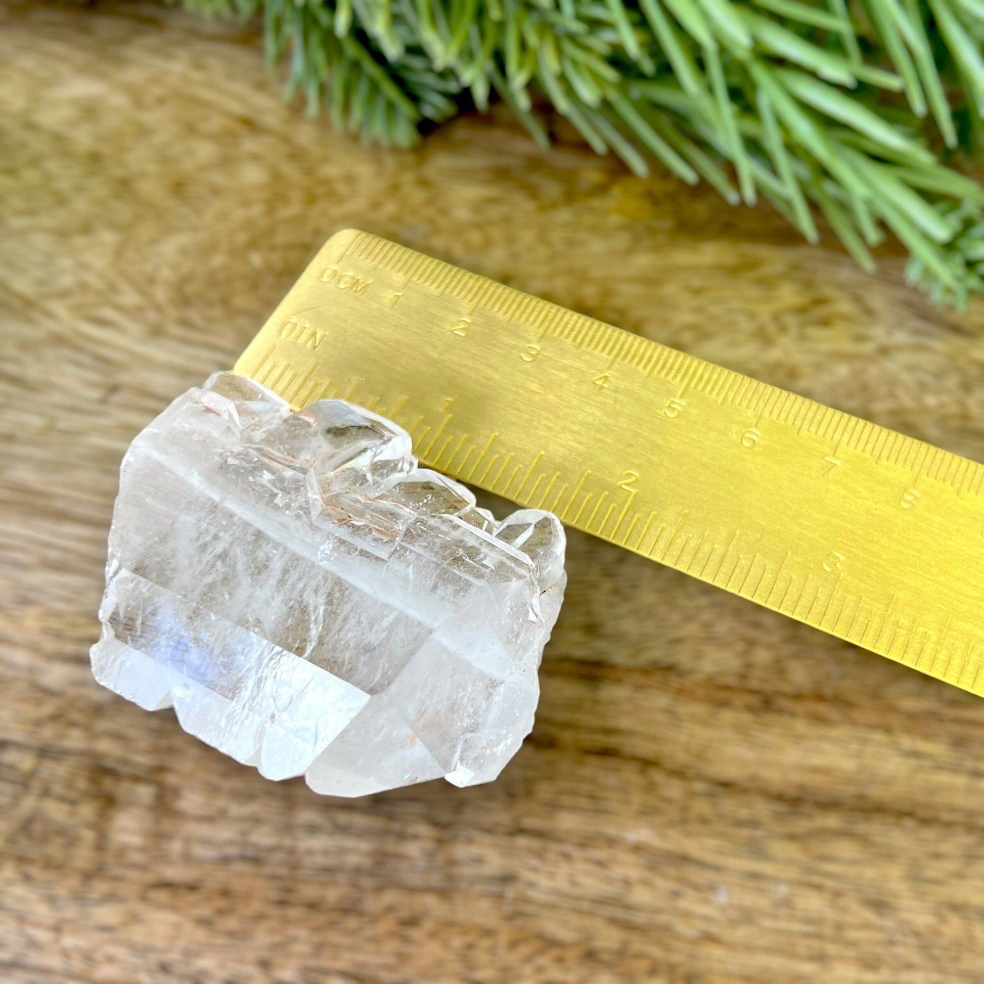 Close up of a Colombian clear Quartz crystal. It is very clear and has Lemurian horizontal lines.