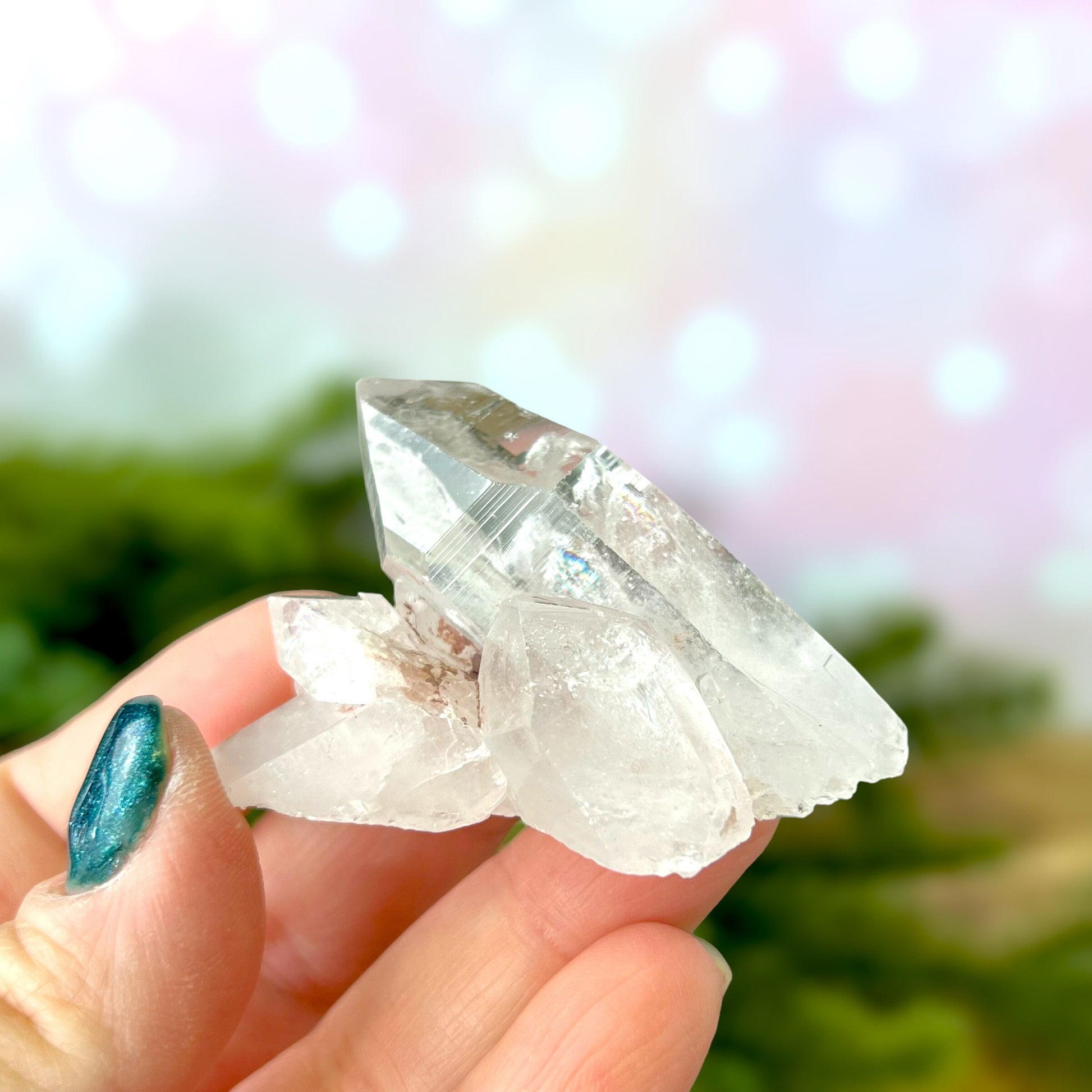 Close up of a Colombian clear Quartz crystal. It is very clear and has Lemurian horizontal lines.