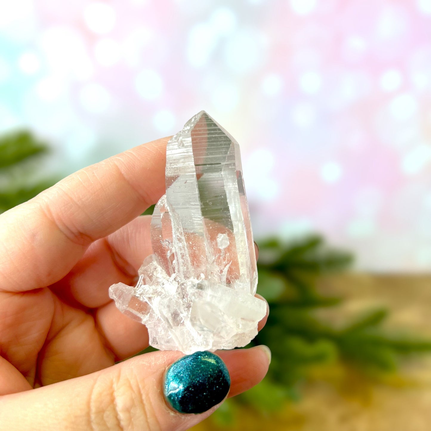 Close up of a Colombian clear Quartz crystal. It is very clear and has Lemurian horizontal lines.