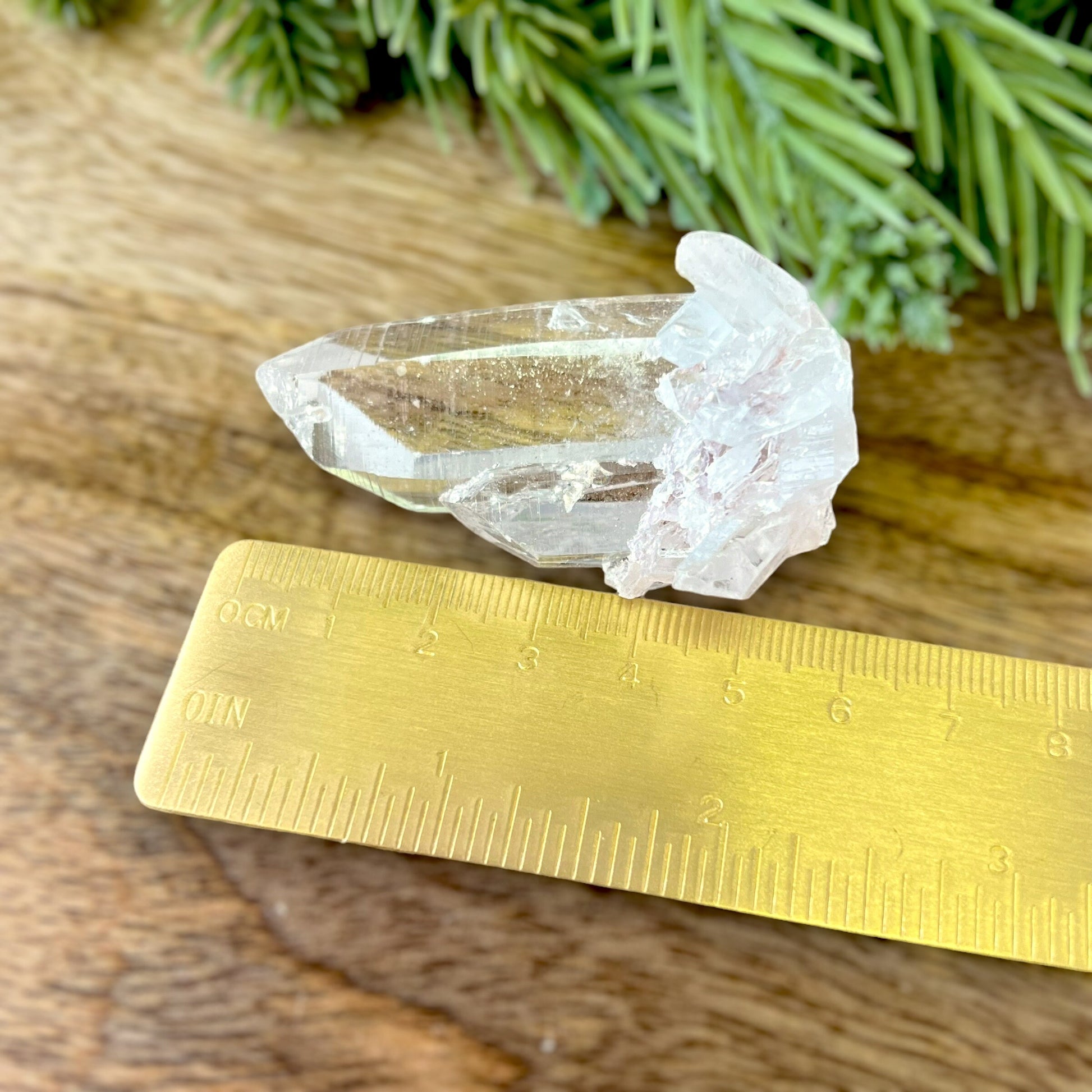 Close up of a Colombian clear Quartz crystal. It is very clear and has Lemurian horizontal lines.