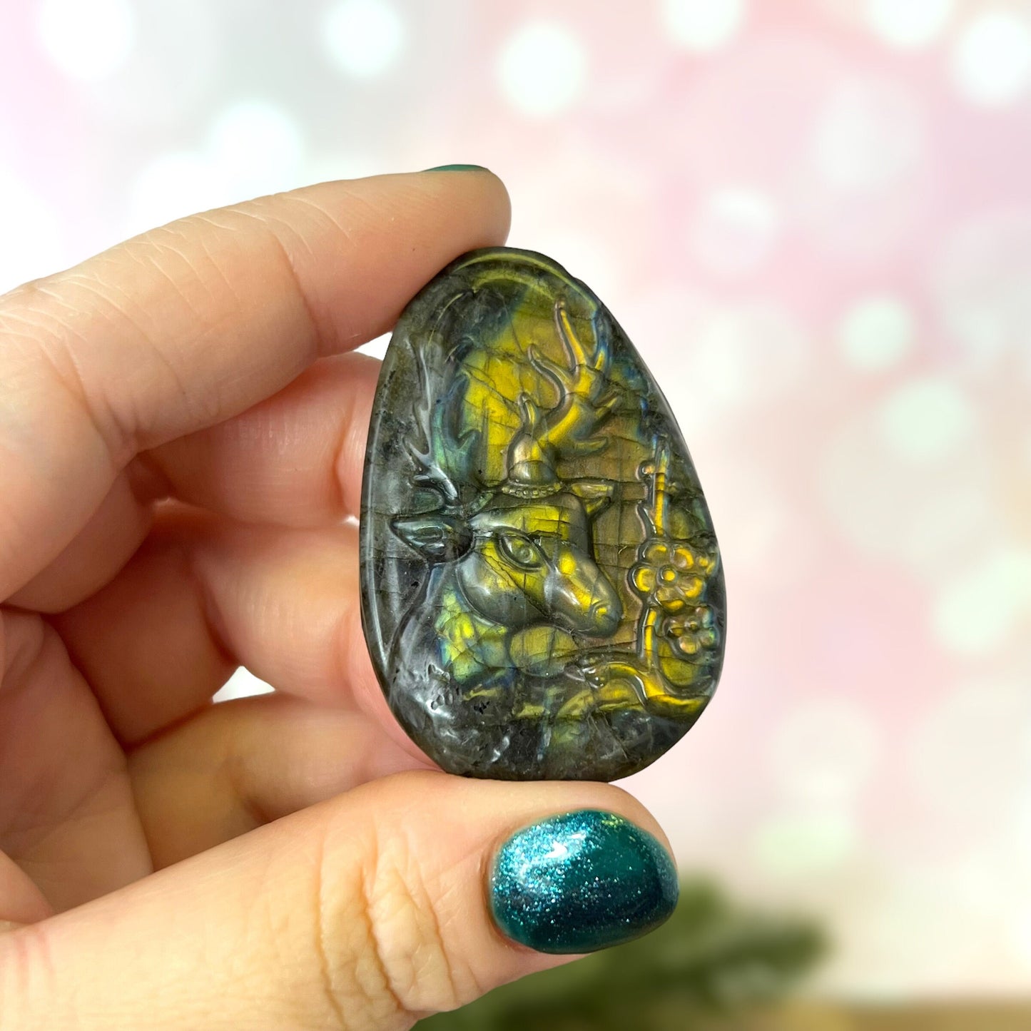 Labradorite Crystal cabochon carved into the shape of an oval teardrop, featuring a stag deer's head