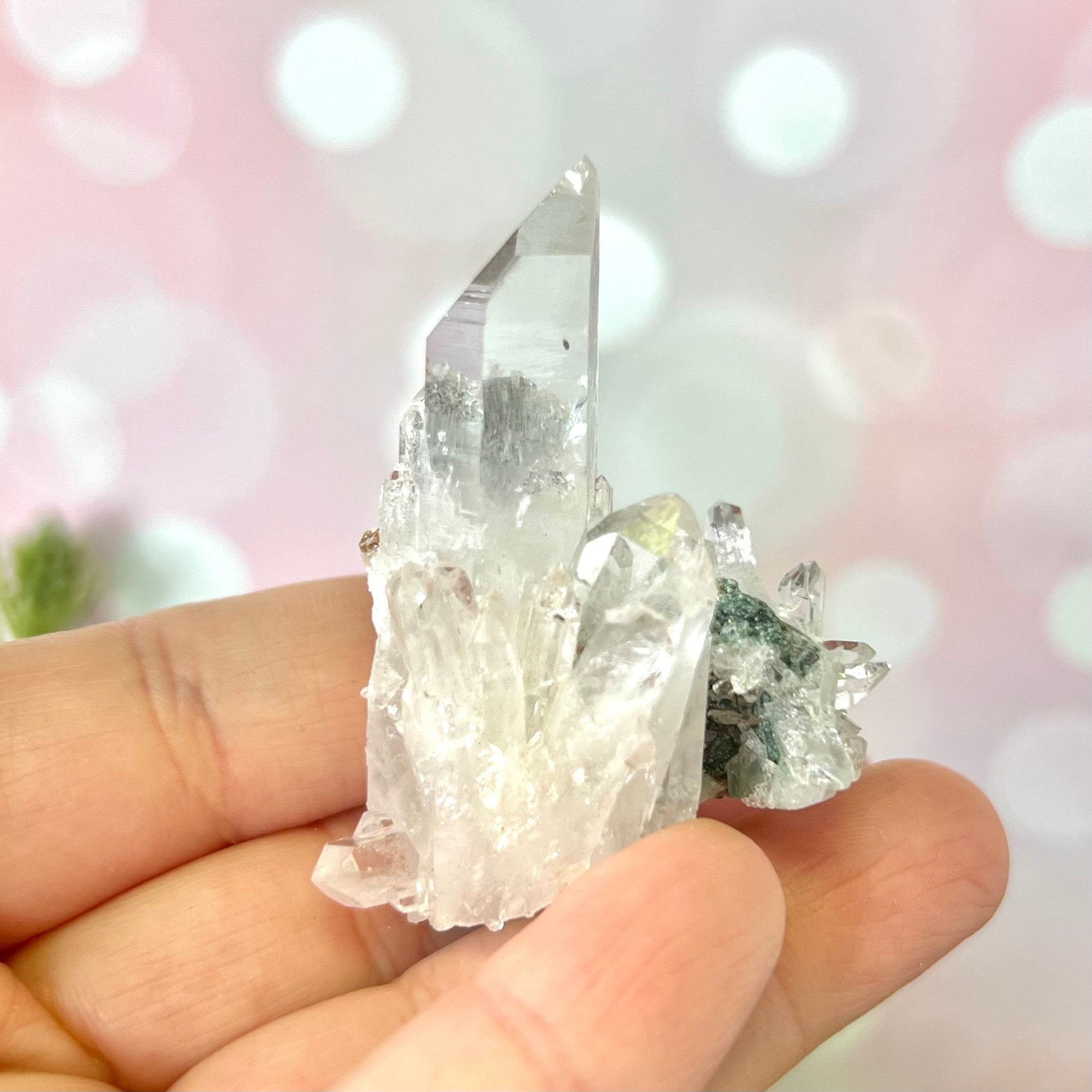 Close up of a Colombian clear Quartz crystal. It is very clear and has Lemurian horizontal lines.