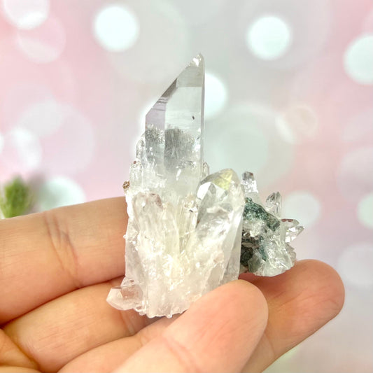 Close up of a Colombian clear Quartz crystal. It is very clear and has Lemurian horizontal lines.