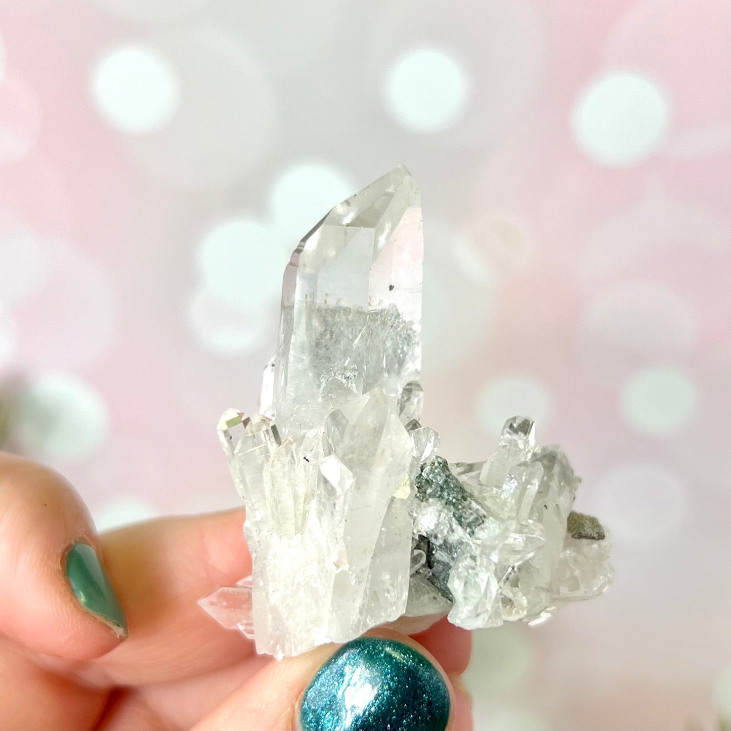 Close up of a Colombian clear Quartz crystal. It is very clear and has Lemurian horizontal lines.