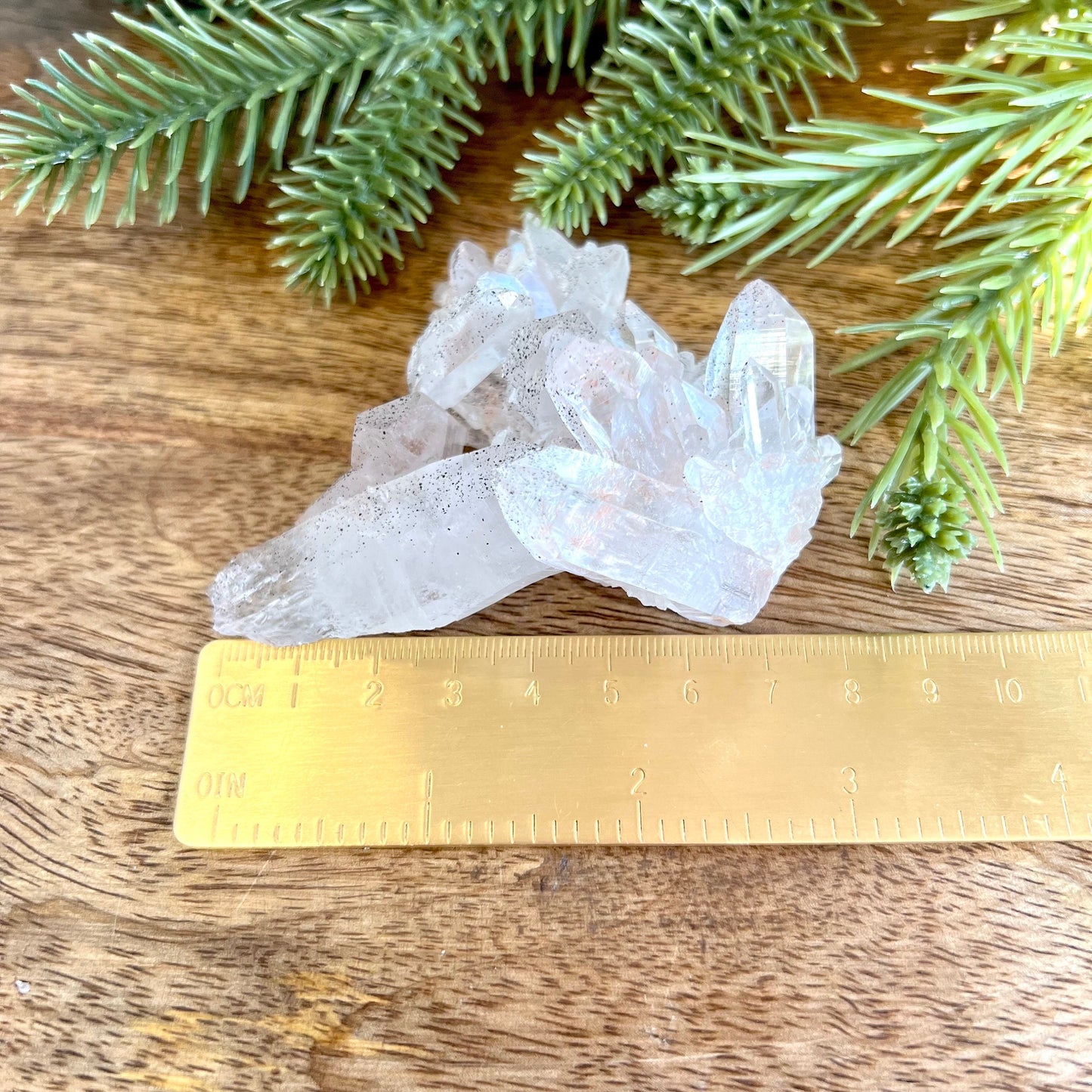 Close up of a Himalayan Quartz crystal cluster covered with small pinprick inclusions of Black Hematite.
