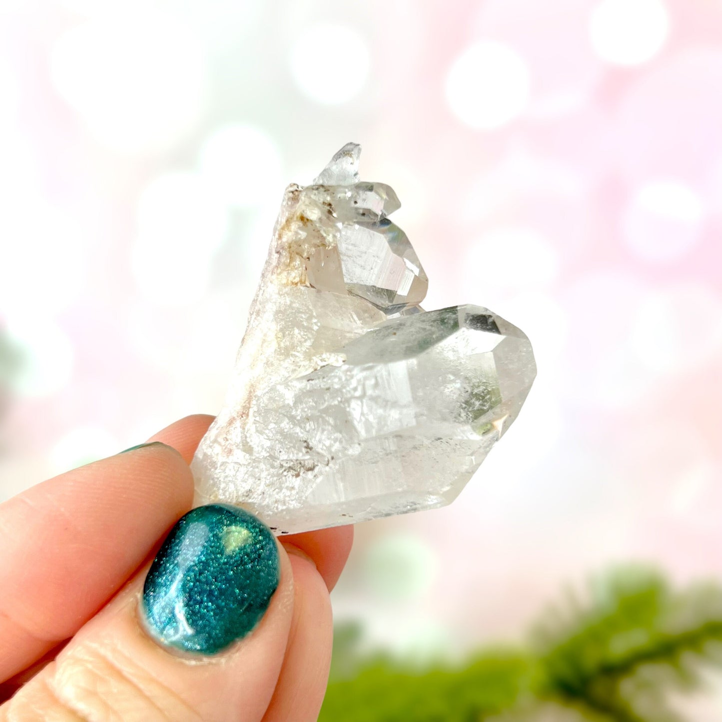 Close up of a Colombian clear Quartz crystal. It is very clear and has Lemurian horizontal lines.