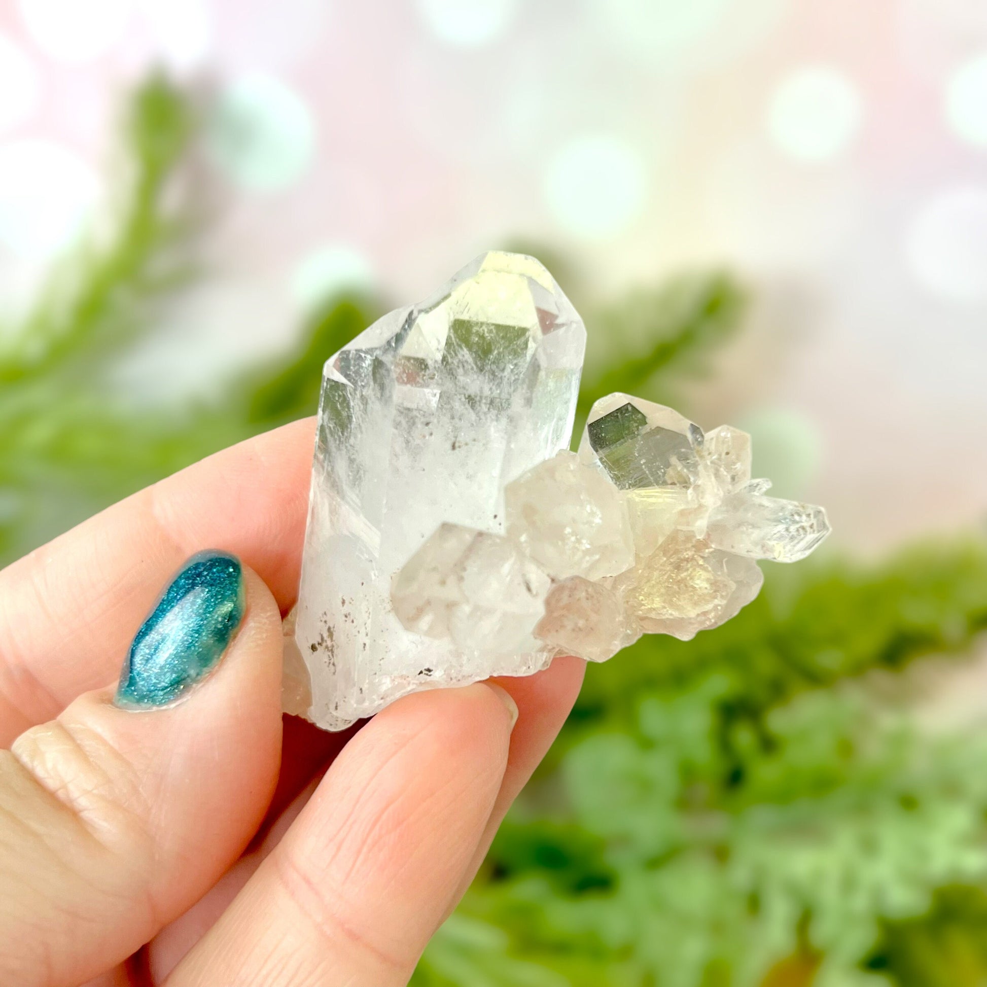 Close up of a Colombian clear Quartz crystal. It is very clear and has Lemurian horizontal lines.