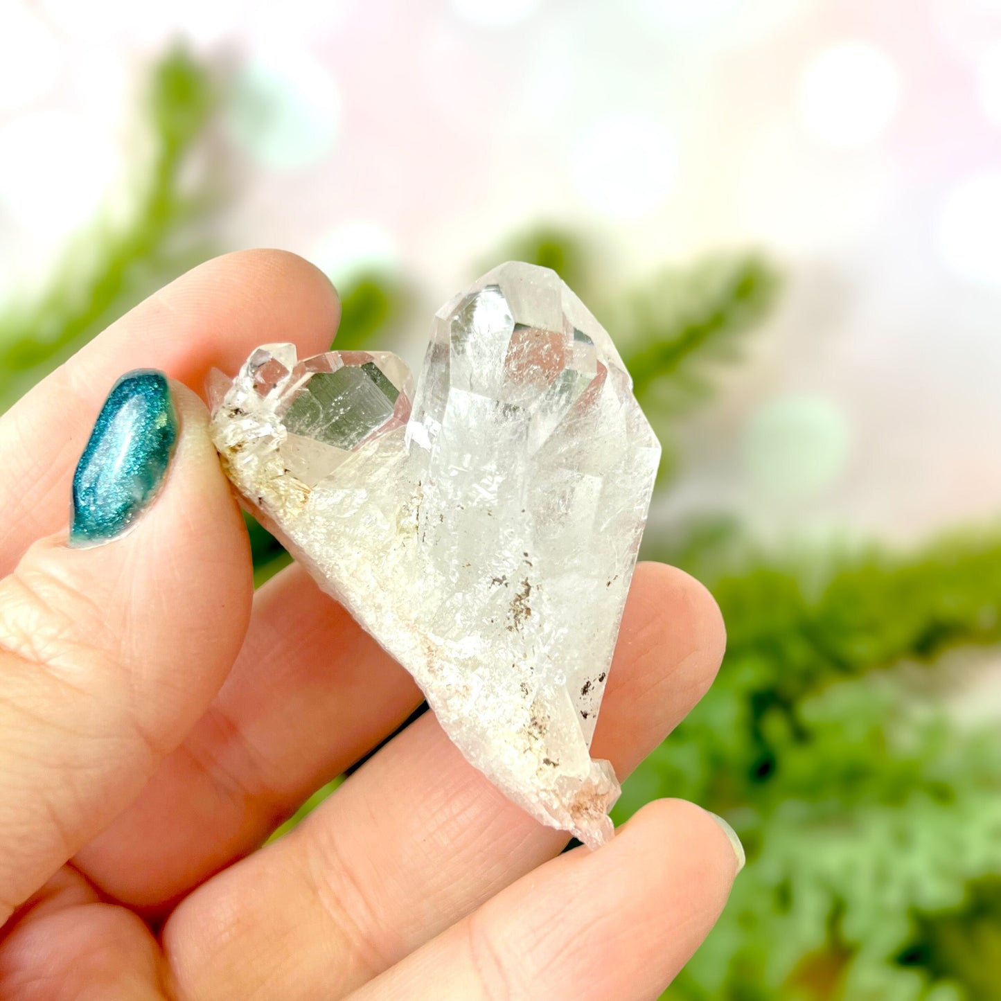 Close up of a Colombian clear Quartz crystal. It is very clear and has Lemurian horizontal lines.
