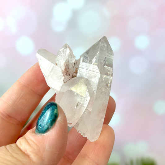 Close up of a Colombian clear Quartz crystal. It is very clear and has Lemurian horizontal lines.