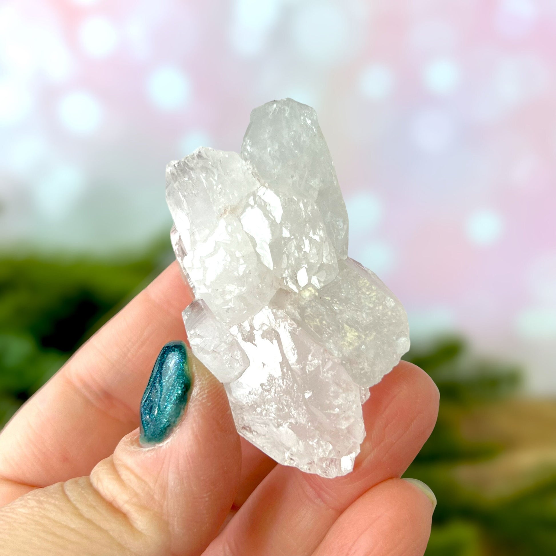 Close up of a Colombian clear Quartz crystal. It is very clear and has Lemurian horizontal lines.