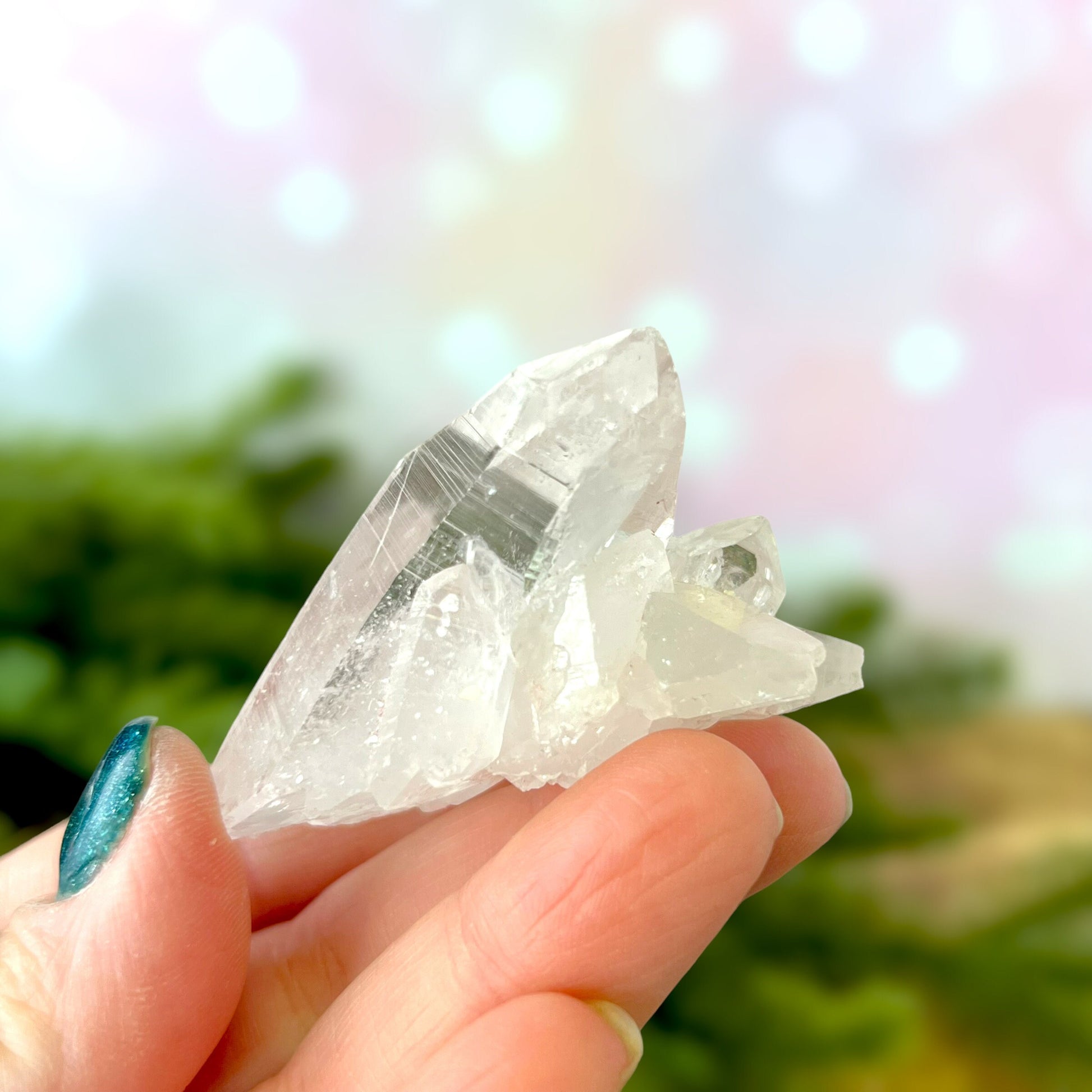 Close up of a Colombian clear Quartz crystal. It is very clear and has Lemurian horizontal lines.