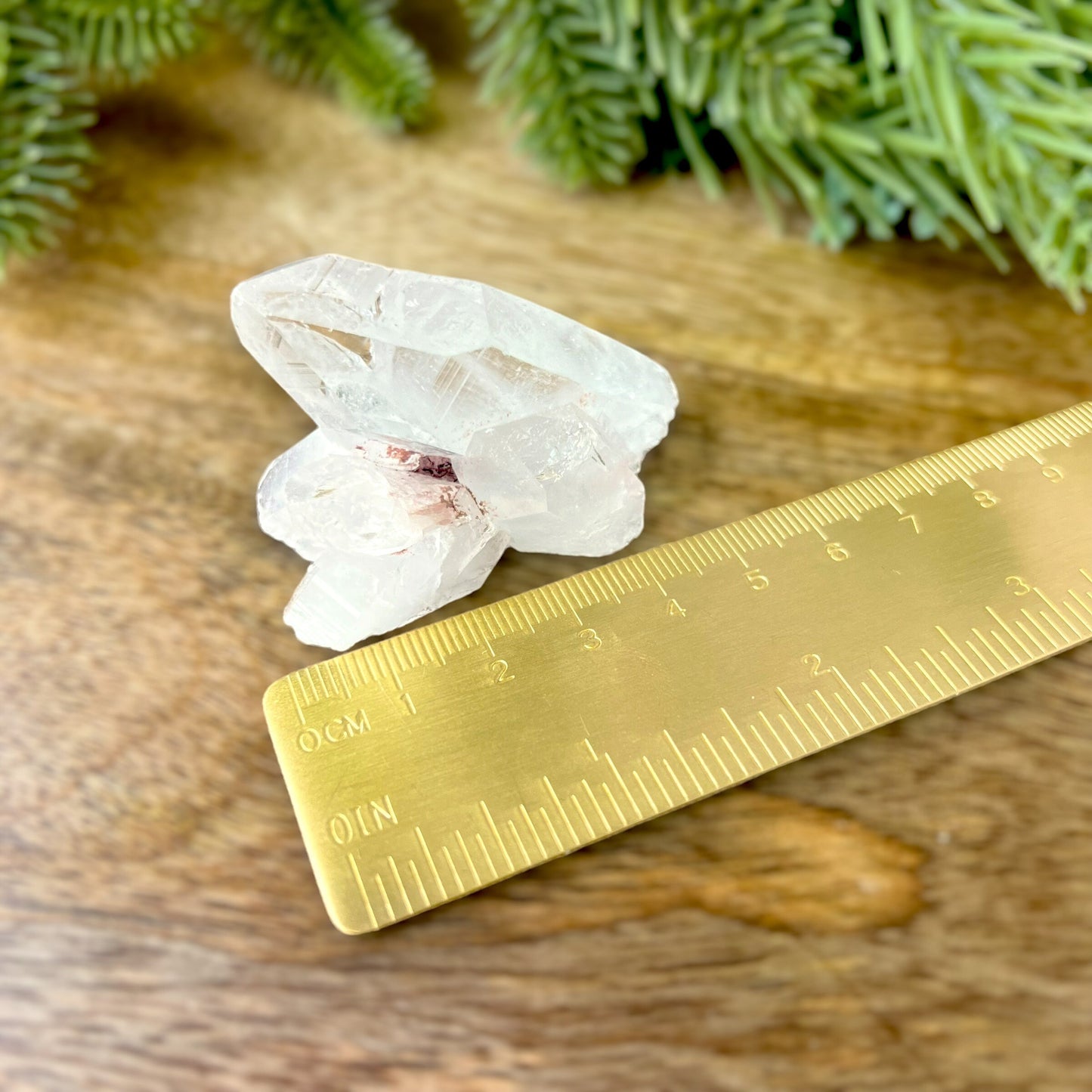 Close up of a Colombian clear Quartz crystal. It is very clear and has Lemurian horizontal lines.