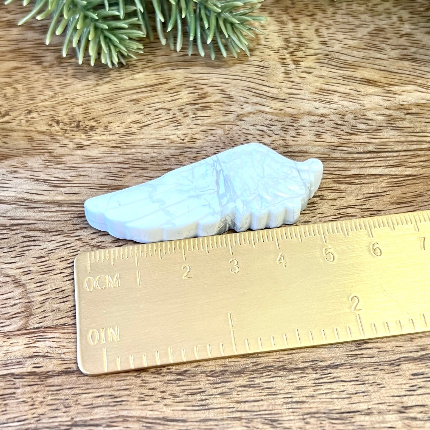 Natural and authentic Magnesite carved crystal cabochon. This Stone Cabochon has been carved into an angel wing