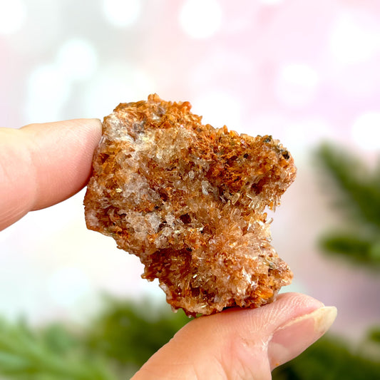Creedite crystal specimen in rusty brown color