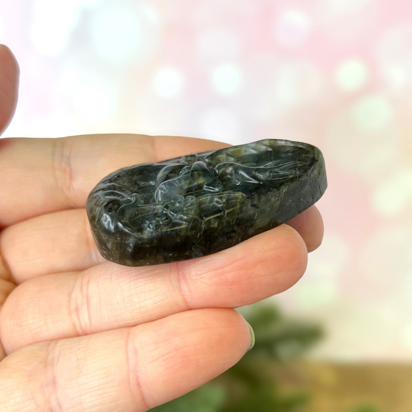 Labradorite Crystal cabochon carved into the shape of an oval teardrop, featuring a stag deer's head