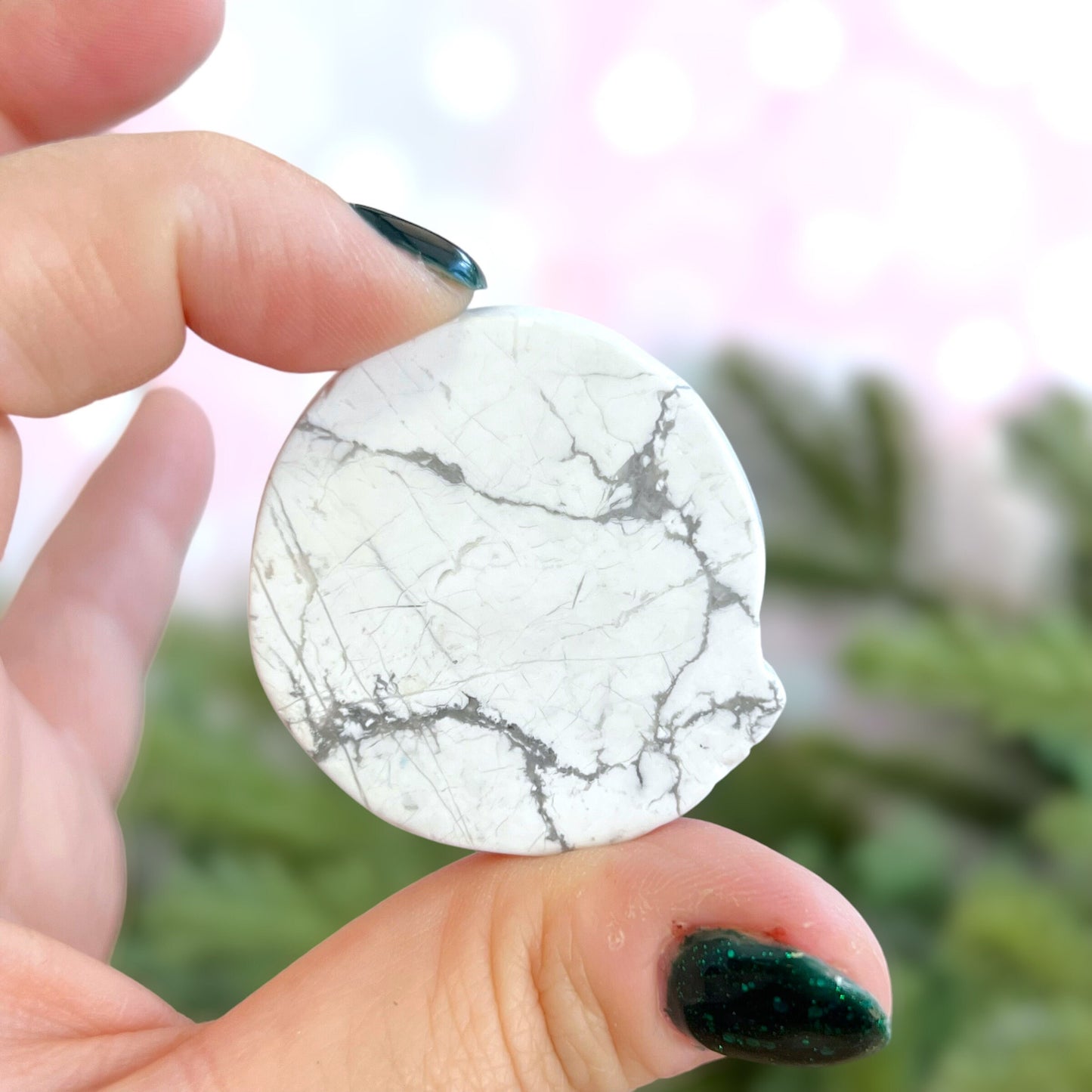 Natural and authentic Magnesite carved crystal cabochon. This Stone Cabochon has been carved into a wolf against a circular Moon.