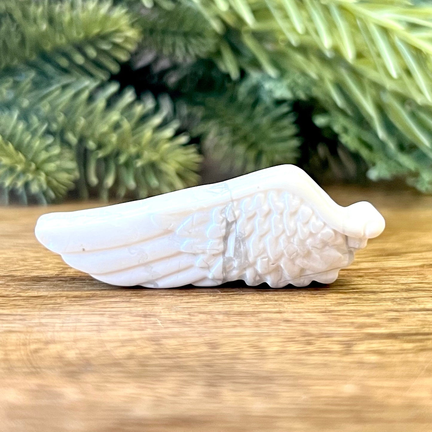 Natural and authentic Magnesite carved crystal cabochon. This Stone Cabochon has been carved into an angel wing