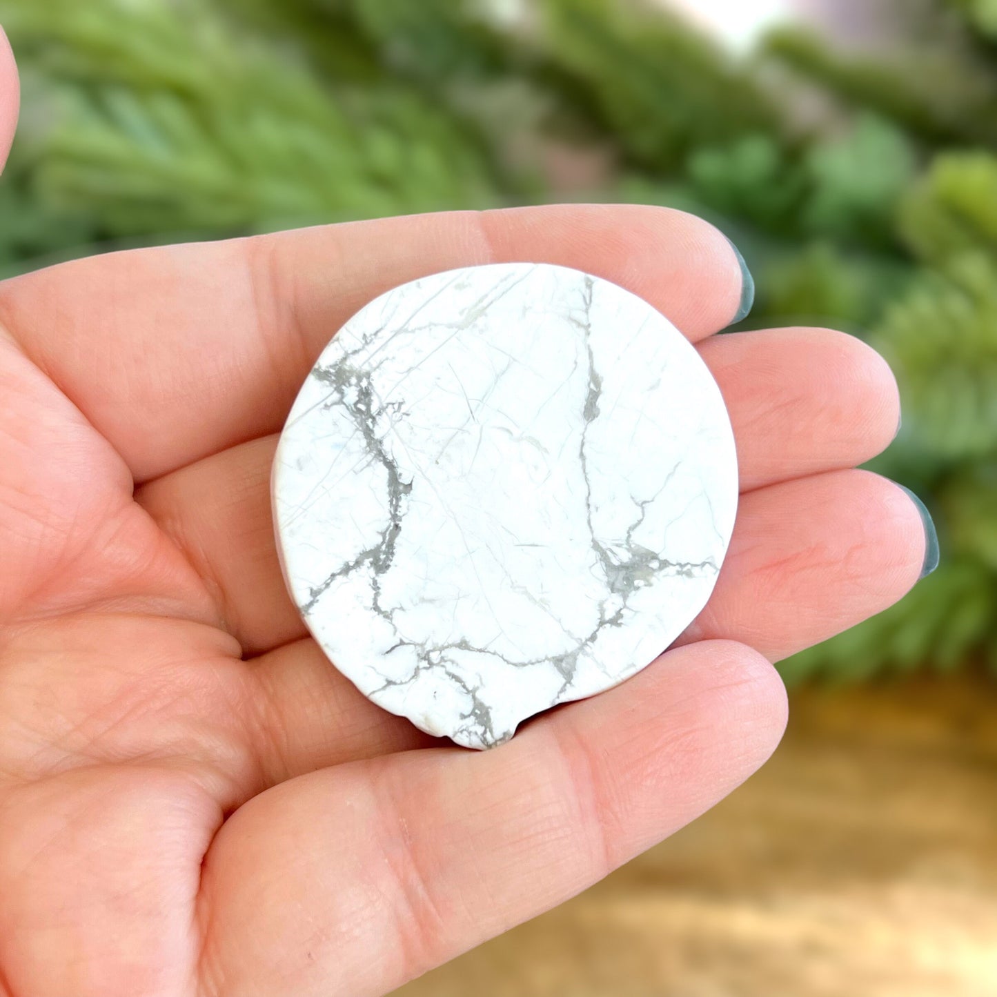 Natural and authentic Magnesite carved crystal cabochon. This Stone Cabochon has been carved into a wolf against a circular Moon.