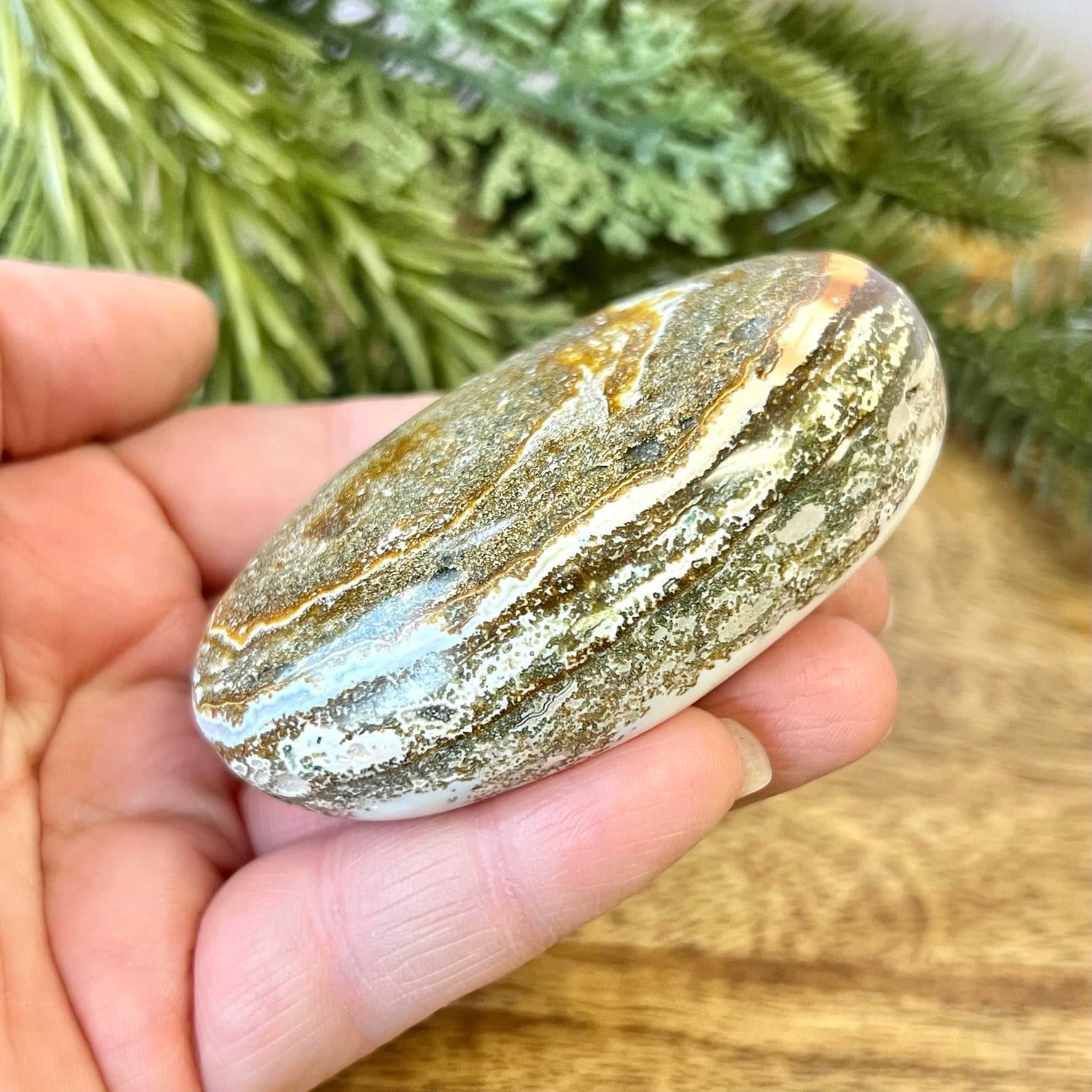 a close up of a person holding a rock