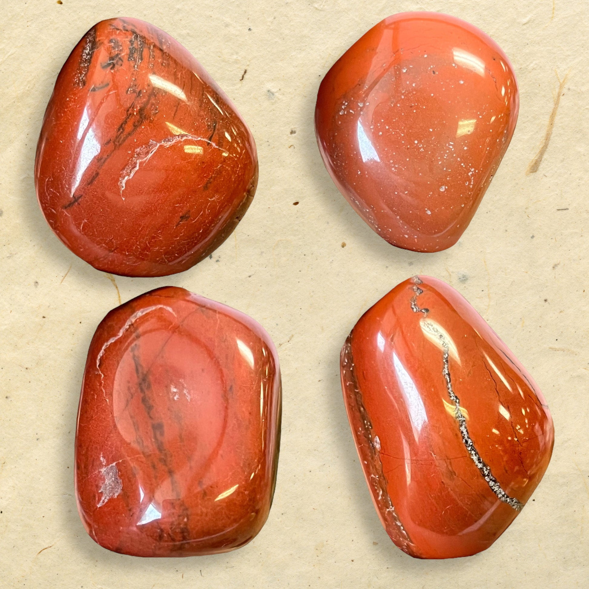 a collage of a group of large red Jasper tumbled crystals