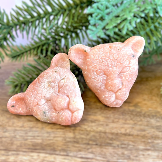 Group of two Orange Calcite carved stone cabochons in the shape of leopard heads