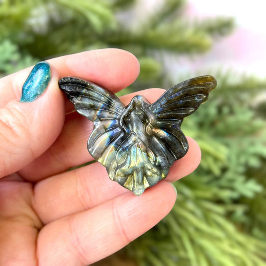 Labradorite Crystal cabochon carved into the shape of a fairy with large butterfly wings