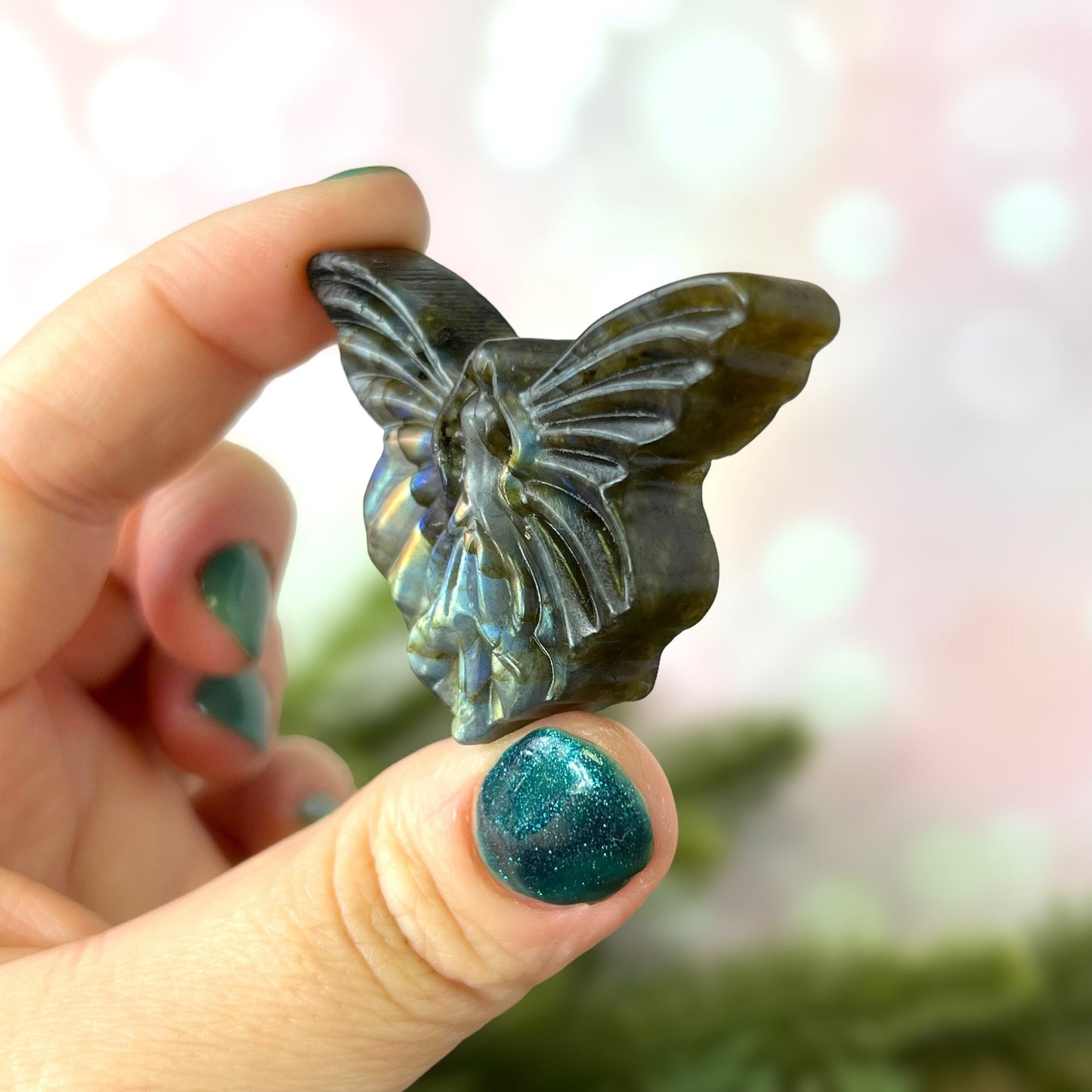 Labradorite Crystal cabochon carved into the shape of a fairy with large butterfly wings