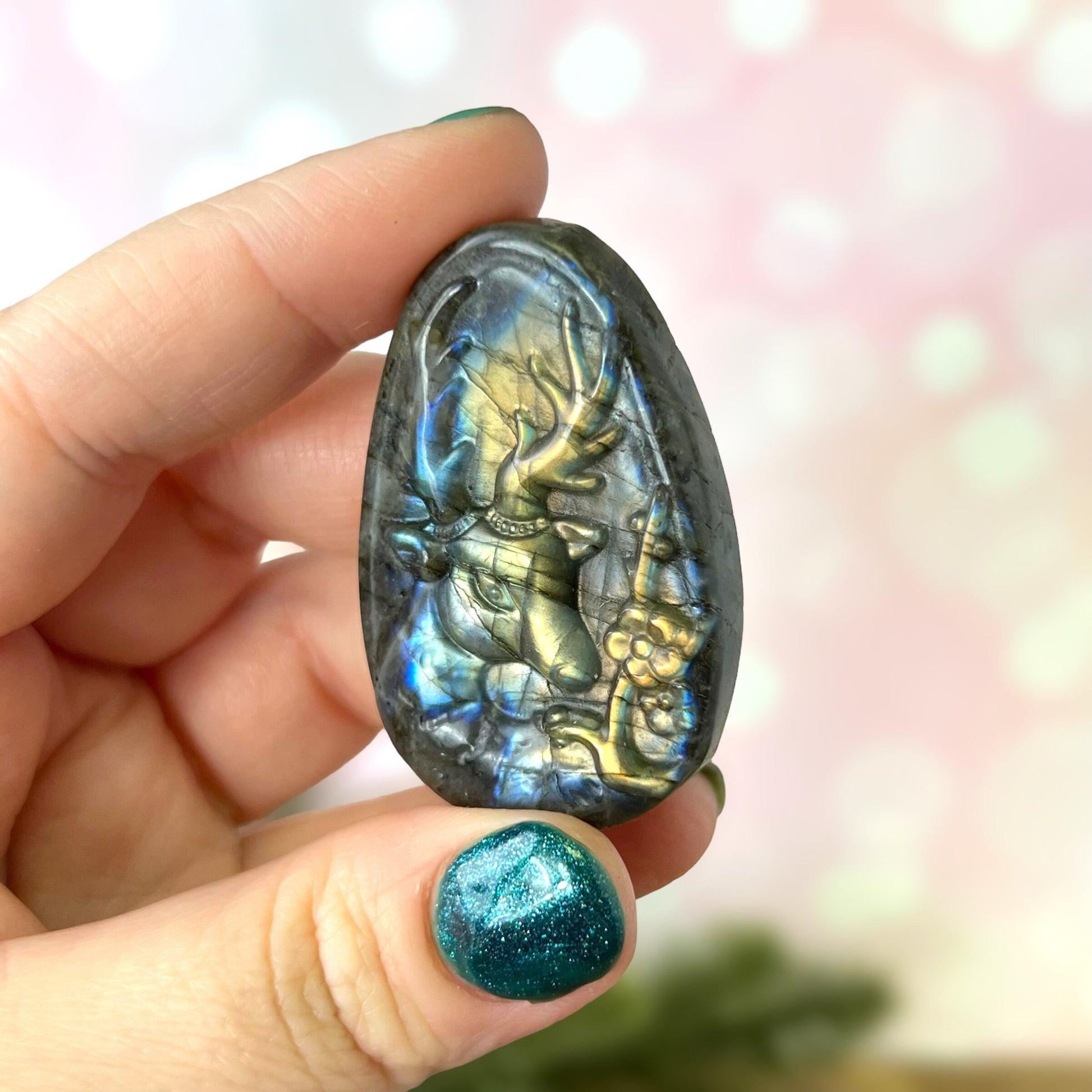 Labradorite Crystal cabochon carved into the shape of an oval teardrop, featuring a stag deer&#39;s head