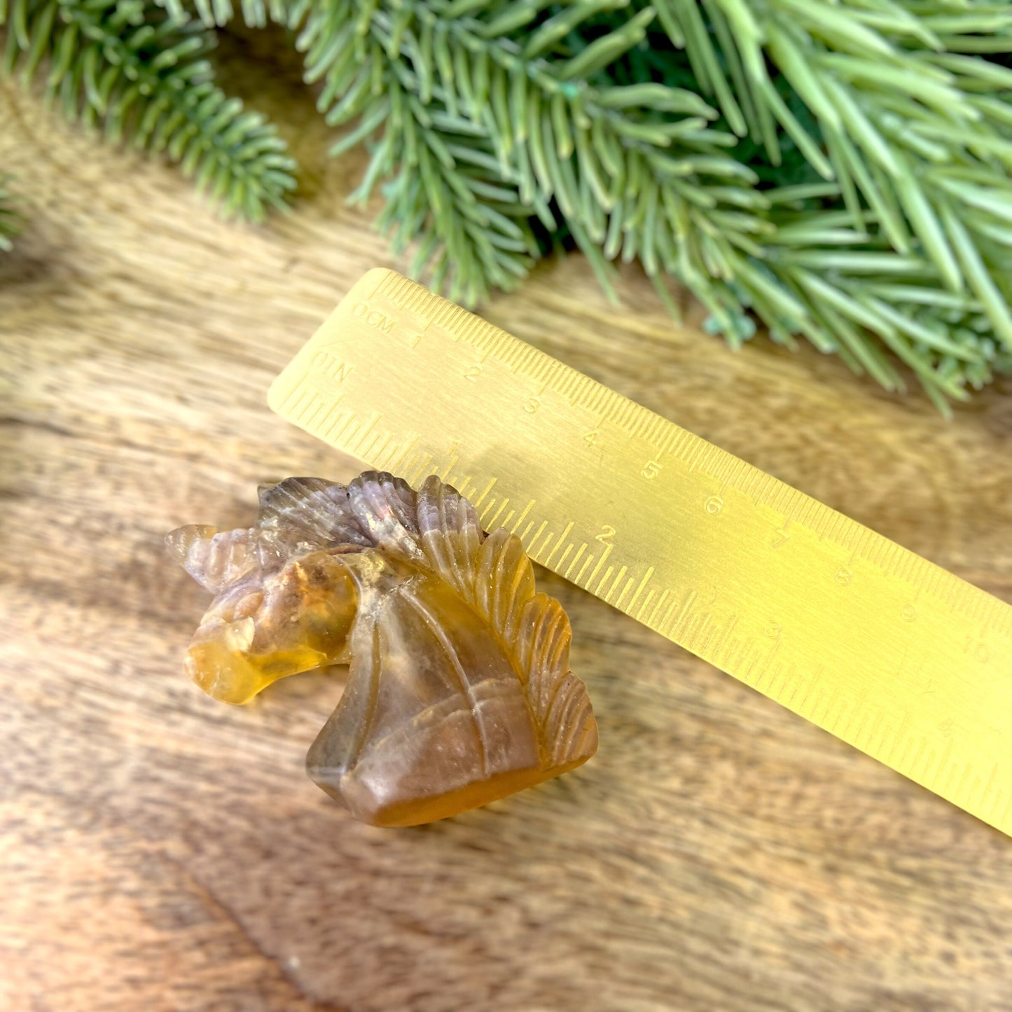 Yellow Fluorite carved stone cabochon featuring the bust of a Unicorn