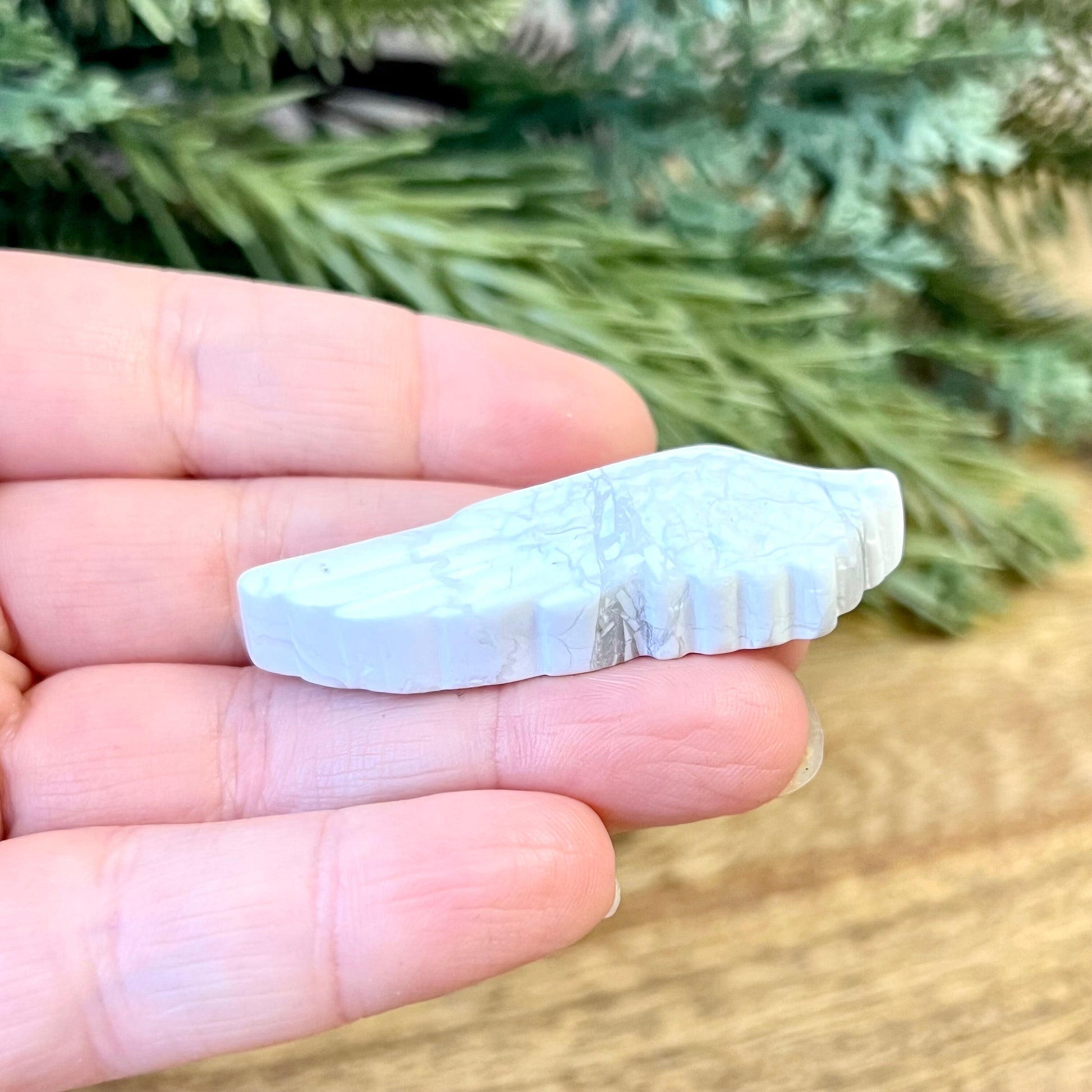Natural and authentic Magnesite carved crystal cabochon. This Stone Cabochon has been carved into an angel wing