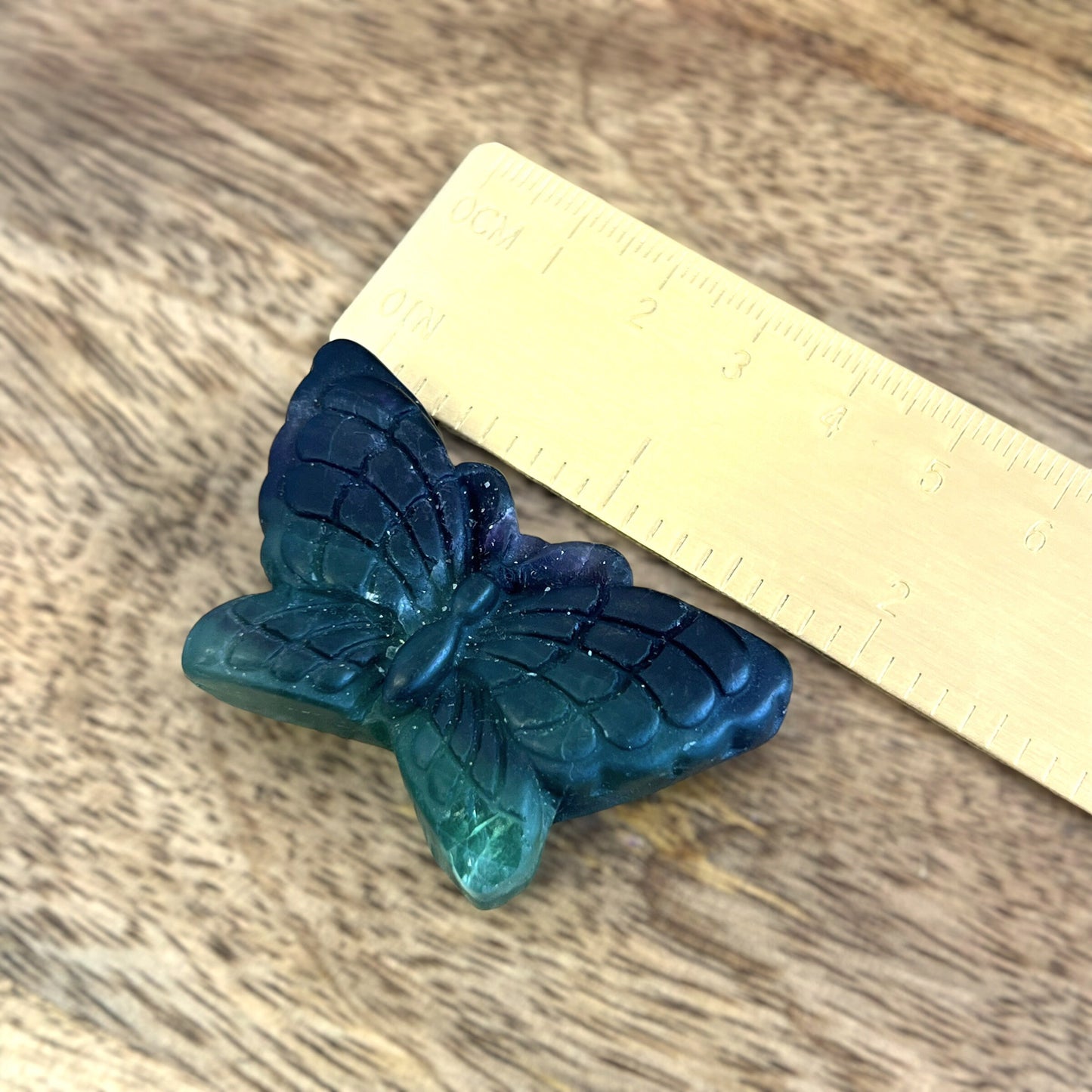 Rainbow Fluorite Crystal carved stone cabochon in the shape of a butterfly