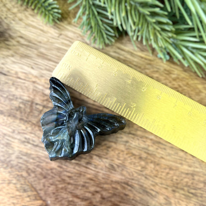 Labradorite Crystal cabochon carved into the shape of a fairy with large butterfly wings