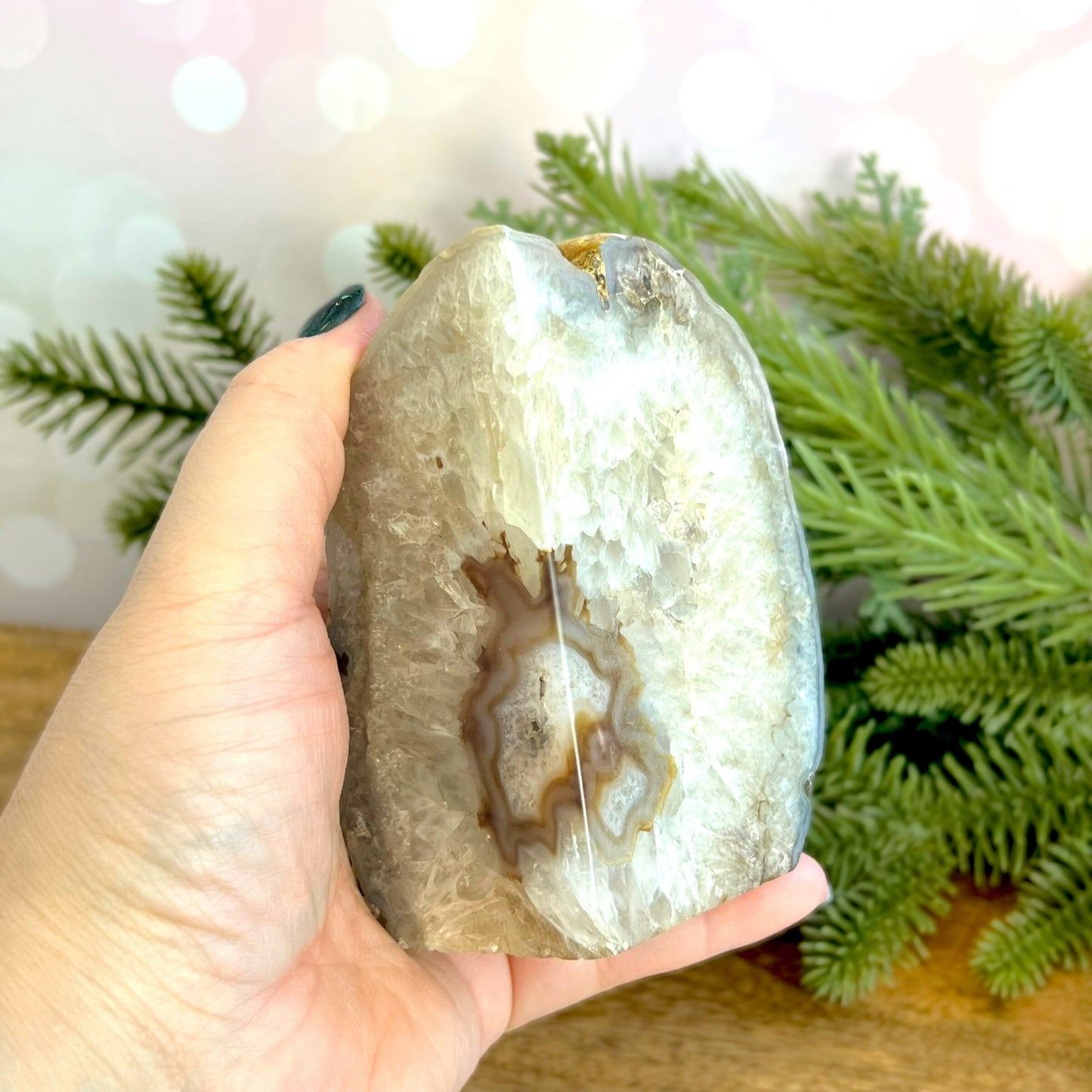 Natural Agate Bookend. Features a slice of cut crystal with raw geode edge and polished inside. Not dyed or heat treated.